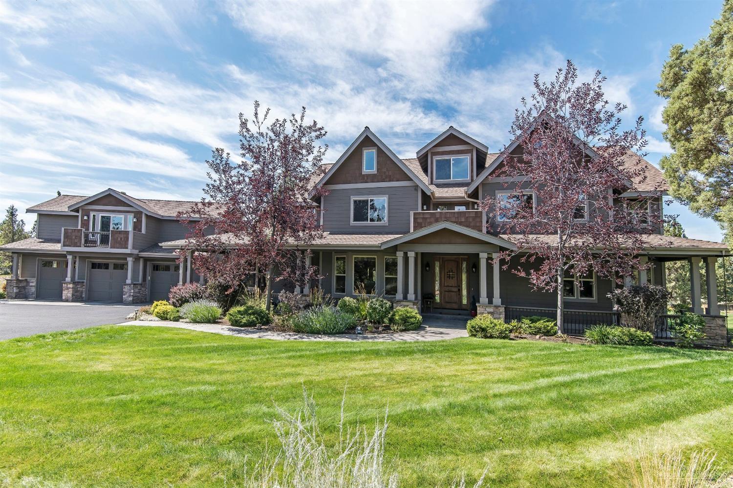 This beautiful custom home is a sanctuary in the country, yet close to town in desirable Overtree Ranch. The peaceful lawns & pond are watered with 1.25 ac of irrigation. Knotty alder trim, walnut wood floors, stamped concrete patios and beautiful wrought iron details highlight this unique property. Dine in the formal dining room or sunny breakfast nook. The master bedroom has a see-through fireplace shared with the master bath. The large soaking tub is light & bright, but affords superb privacy, and the tiled shower has 2 shower heads. There is a private deck off the master rear-facing the historic canal. There is an en-suite guest room. The expansive 3rd floor space is full of possibility w/ speakers, home theater wiring, plumbed for water, and limited mountain views. The detached 3-car extended length garage has a 2 bed/1 bath mother-in-law quarters above. This property has so many details, they can't all be mentioned. See amenities list in Attached Docs for more.