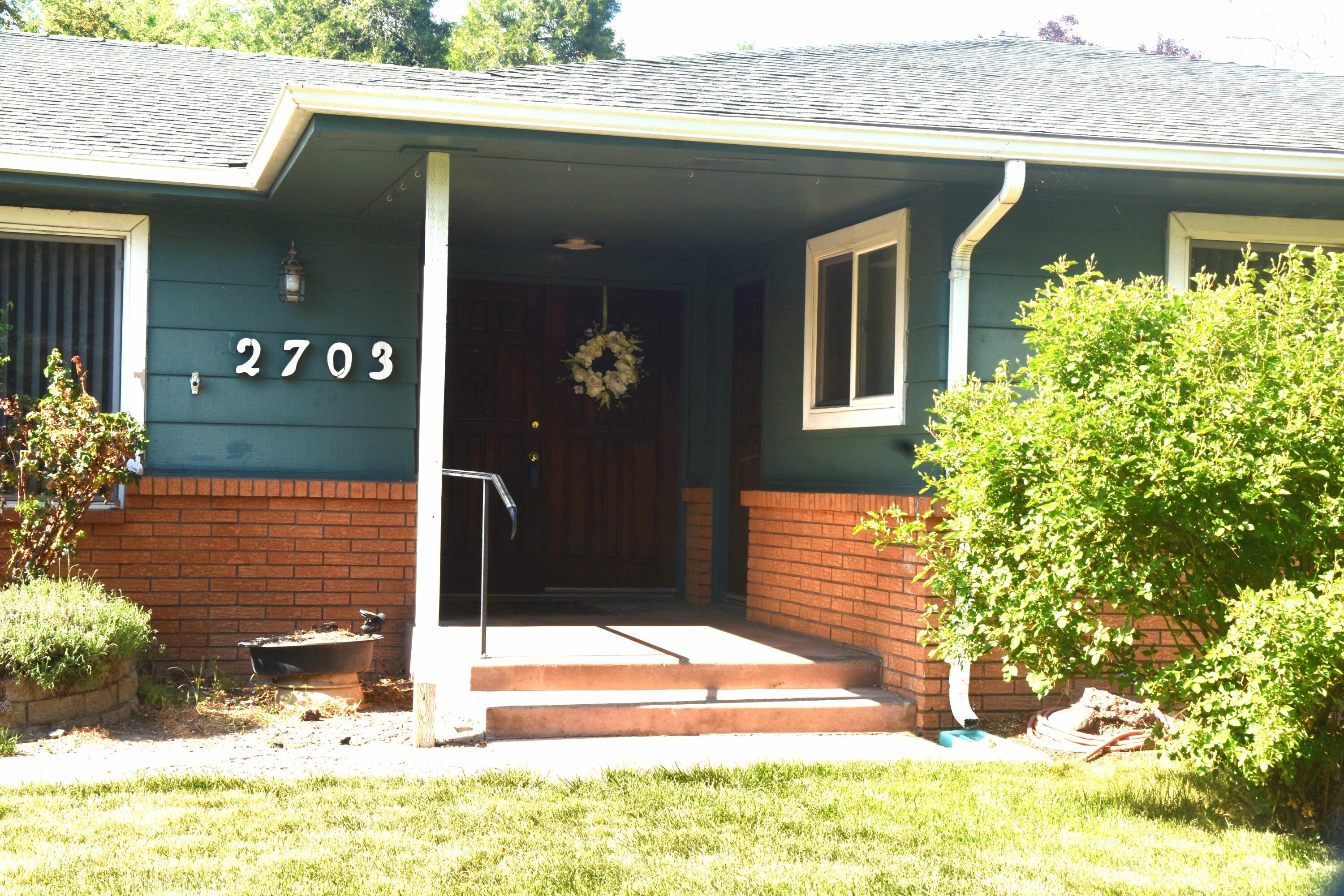 Expansive 4 bedroom 2 bath  ranch home with spacious rooms makes for very  comfortable living. Quite neighborhood conveniently located close to shopping and schools. Unique 6 bay pull through garage with workshop area. RV parking is  accessed from alley in rear. Front bedroom has separate exterior access.  Entertain your guests in the formal dining room and large step-down  living room.  Indoor plant trellis stays with the home. Skylights in family room let in natural light. Large deck off master bedroom leads to private backyard. Home has recently been renovated with new interior paint, flooring and tile in the master bathroom.