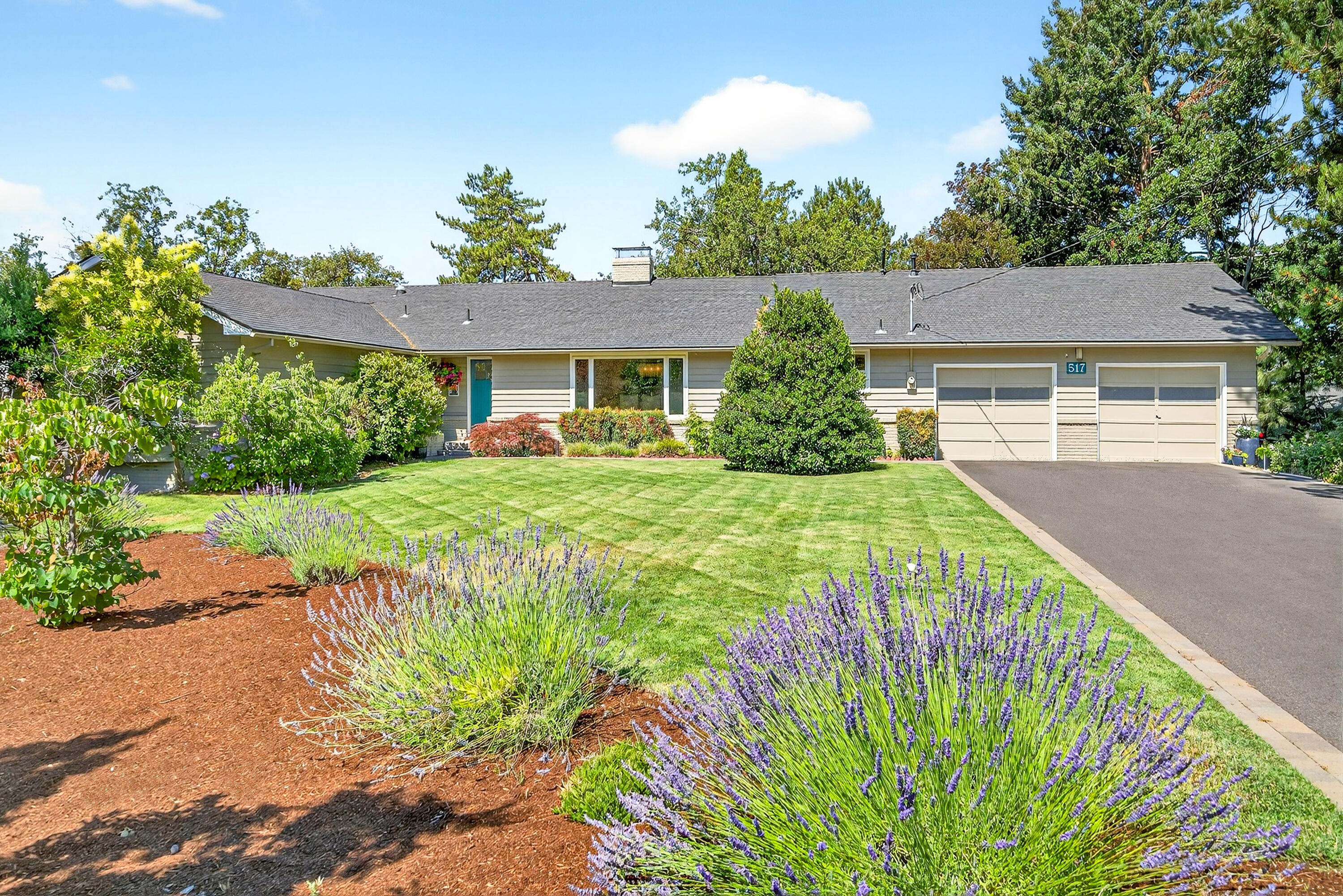 A unique East Medford treasure! Situated on a .74-acre lot in a serene park-like setting, this classic single-level home offers the perfect blend of comfort, character, and timeless charm. Warm hardwood floors, colorful finishes, and sun-filled spaces invite you to relax and gather with ease. The professionally updated gourmet kitchen is the heart of the home, where a Viking 6-burner range, cherry cabinetry, and generous island invite you to cook and savor life's simple pleasures. The expansive great room opens to a private backyard oasis with in-ground pool, trellis patio, and lush, mature landscaping. Enjoy peaceful mornings under the trees, afternoons by the pool, and evenings by the fire. Featuring 4 bedrooms, 2.5 baths, a bonus room, and generous living spaces with 2 fireplaces, this home offers a lifestyle of beauty, ease, and connection. Convenient to shopping, parks, schools, medical, and the Country Club. Built for meaningful moments and lasting memories.