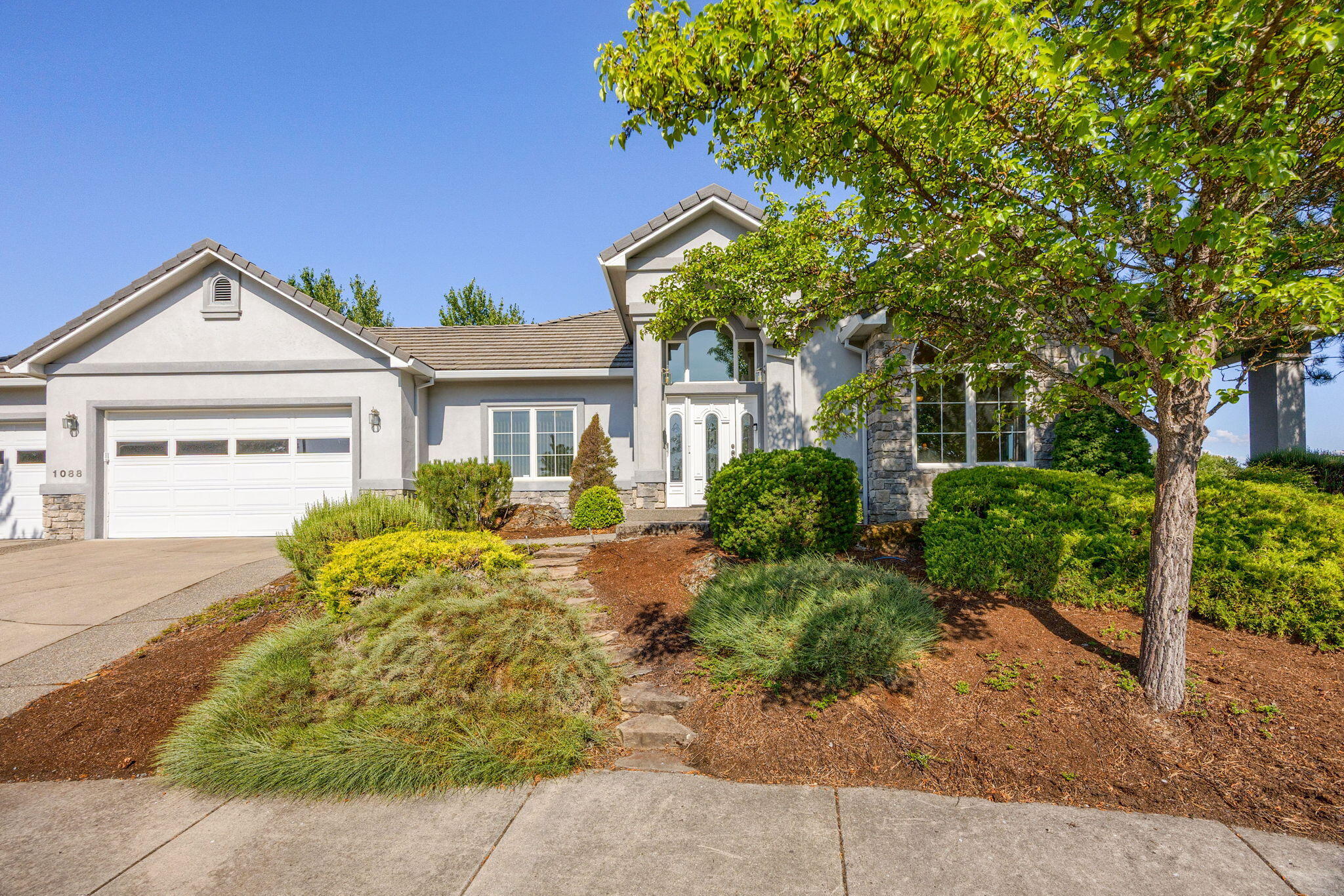 First time on the market. This one owner custom-built single-story home is situated on a quiet cul-de-sac and located on the 4th Tee and views of several Fairways of the Eagle Point Golf Course. This well-maintained home features 3-bedroom, 2.0 baths, 2,655 sq.ft. with an open floor plan & lots of built-ins. Huge kitchen with custom Hickory cabinets, granite counter tops, large island, Walk-in pantry & high tray ceilings. Great room with gas F-P, built-in entertainment center and 12' ceilings. Two nice size guest bedrooms and guest bath. Beautiful primary suite with His/Her walk-in closets, jetted tub, custom 8' tiled shower, double sink vanity and slider access to covered rear patio overlooking the golf course. Central Vacuum, large interior utility room w/utility sink, 3 car attached garage with extra storage. Enjoy the 430 sq.ft. of covered rear patio with amazing views of the course. This gorgeous home sits on a large 0.31-acre level site with easy care landscaping and a Koi Pond.