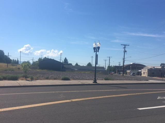 1-acre level lot zoned General Commercial located along a major artery into downtown Klamath Falls. Prior MedoBel Creamery site. Hot temperature geothermal well previously on site.  Unique opportunity to develop the level site with ingress/egress from Spring Street but with Esplanade frontage. Property is owned by Klamath County and was obtained through tax foreclosure so a Quit Claim deed will be issued to the buyer at closing. Buyer to perform due diligence in regards to geothermal potential, buildability, utilities, future tax liability, etc.