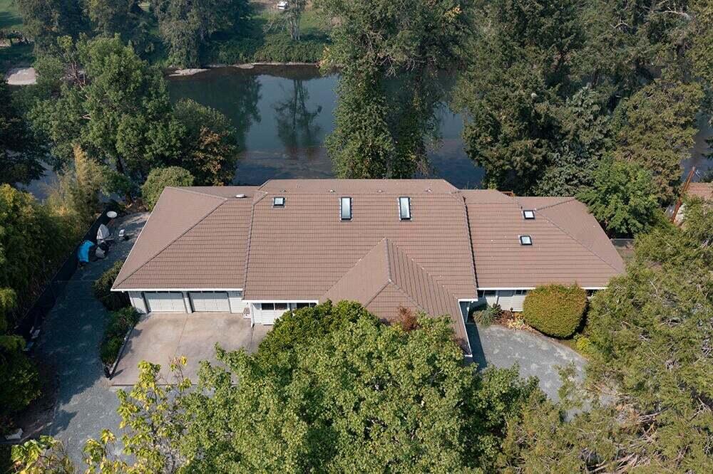 Riverfront oasis with two decks overlooking your private river bank. This amazing 3304 square-foot home features a world-class kitchen, complete with slate floors, subzero refrigerator, slab granite countertops, double ovens, warming drawer, skylights, and ample cabinetry. This 3 bedroom 2 1/2 bath has great natural lighting, vaulted ceilings, amazing windows overlooking the river from the living room and formal dining room. Primary bedroom has soaking tub, walk-in shower and walk-in closet. Guest rooms have Jack and Jill bath. Outside there's a 2000 square-foot shop with full bath and finished room. Multiple RV hook-ups, pond with waterfall, fruit trees, irrigated pasture, iron security gate, dramatic lamped entry drive, circular driveway, private pathway to the river, and more. Seller financing available at 5%.