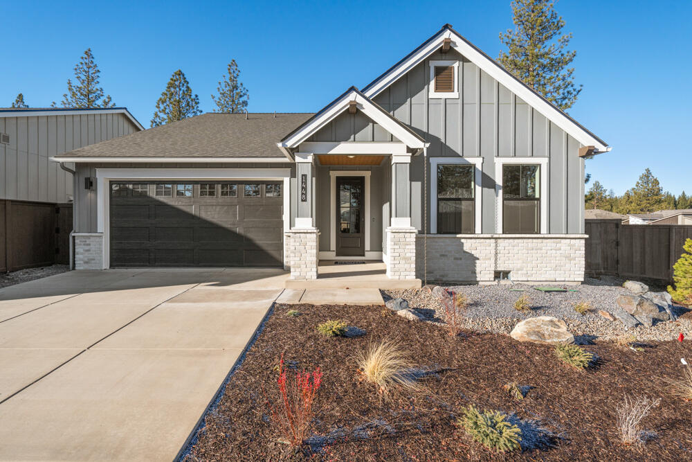 MOVE-IN READY Home site 55, come experience the serene setting of Collier, Pahlisch Homes Signature community in northwest Bend. With nearly all home sites backing green space the feeling here is incredibly peaceful. Situated less than a mile from the shops and restaurants at Northwest Crossing and nearby parks and schools you are close to all the happenings in northwest Bend. Enjoy having all the trails right outside your backyard and easy access to Mt. Bachelor and the Cascade lakes. The Wentworth floor plan will dazzle you with its ideal size and open space. Natural light from the abundance of windows make this home light and bright. With the two guest rooms and office that could easily work as a forth bedroom, with a spacious primary suite this home is perfect for the downsizer or the family with a work-at-home professional. High-end finishes like JennAir appliances, tile walk-in shower and engineered hardwood floors complete this stunning home.