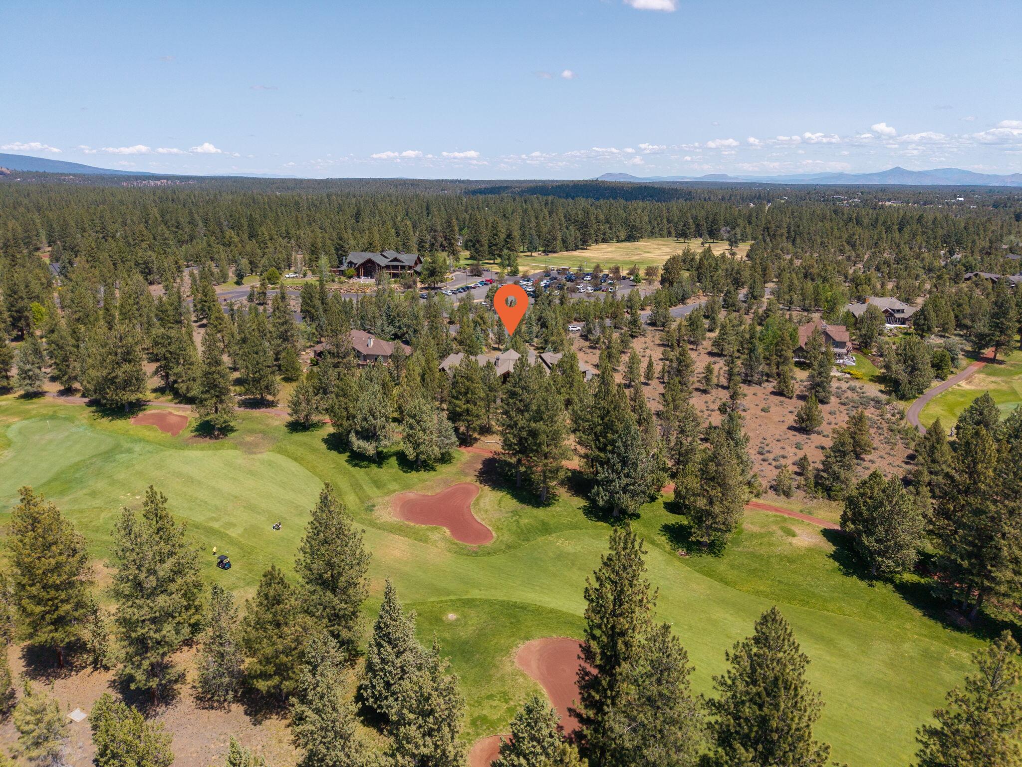 This is an exceptional home nestled in the prestigious Aspen Lakes Golf Community in Sisters, OR. This timeless Northwest lodge style home is all one level living, with a large bunkroom w/wet bar & full bath upstairs. Showcasing unparalleled craftsmanship w/ wood beams/accents & custom built-ins throughout. Thoughtfully designed open concept, with dining area & large kitchen w/ eating bar & nook. Three bedroom ensuites on the main level that are perfect for all of your guests! A dedicated office w/golf course views. Soaring vaulted ceilings & expansive windows flood the interior w/natural light & showcase the stunning outdoor scenery. Wide hallways, rich wood flooring & generous closet space enhance both comfort & function. Step outside to a recently refinished wood wrap around back deck, ideal for entertaining and taking in views of the fairways & Cascade Mtn views. The oversized 3 car garage offers storage w/ a workshop or hobby space. This is refined mountain living at its best!
