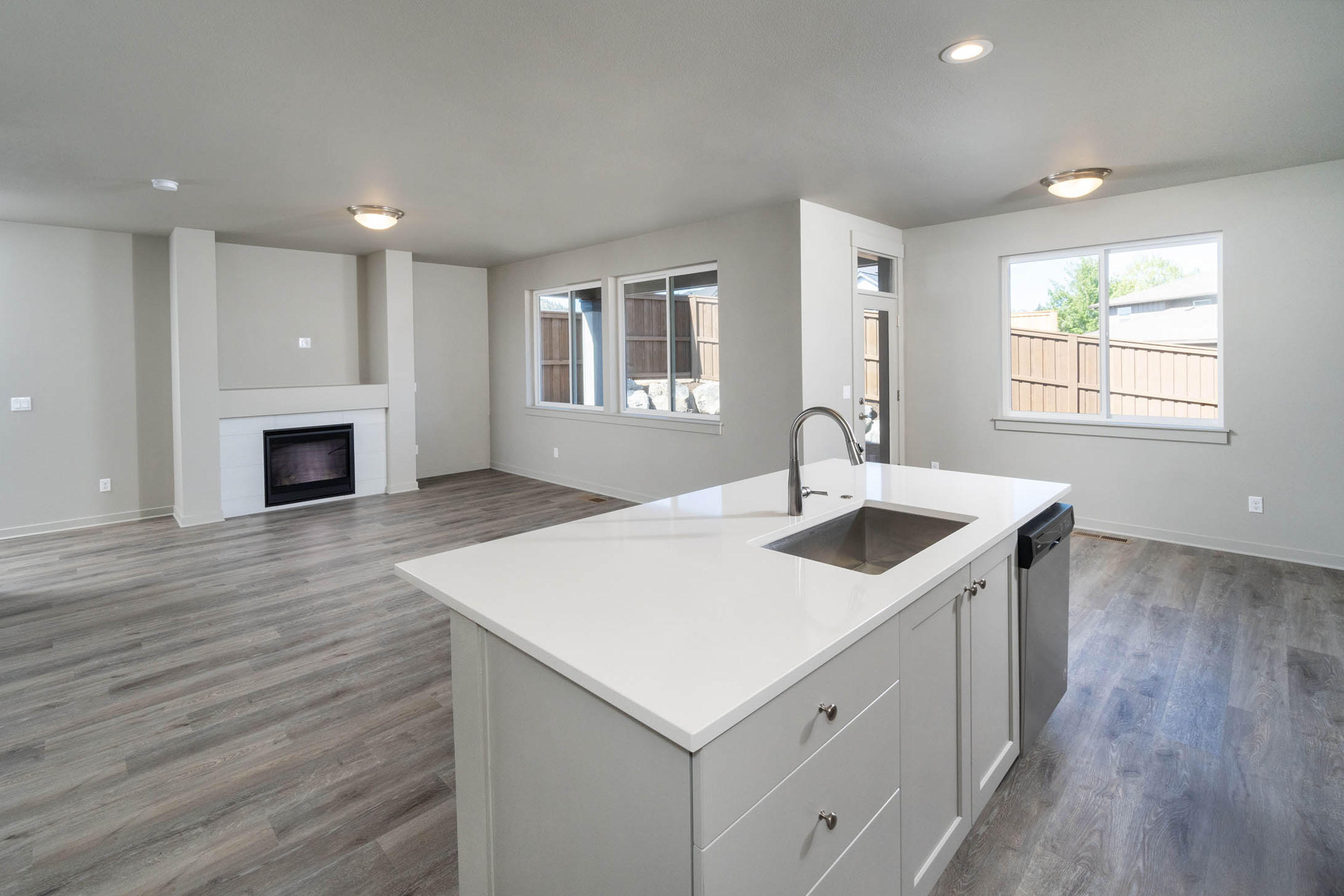 This Atwood (Left) plan is full of many quality finishes such as quartz counters throughout, stainless steel appliances, A/C pre-wired, 2 car insulated garage, gas fireplace in the great room, and an island counter space for entertaining. This home also has a covered patio and larger fenced rear yard. The great room is SW facing for great natural light! Residents enjoy the proximity to shopping on the east side of town and access to Highway 20. Nearby schools, parks, restaurants, and medical facilities are just minutes away.  Located on the Northeast side of Bend behind St. Charles Medical Center. Take 27th St. to Courtney. *Virtual tour is an example of finishes and not of actual home. Come see why Pahlisch has won 150+ Quality & Value Awards! Photos of similar home, specs vary.