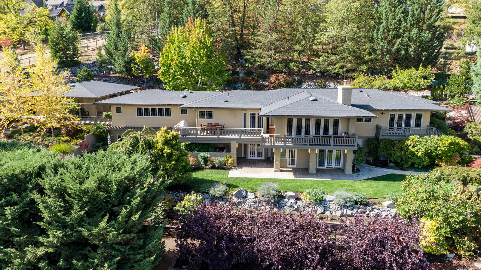 Incredible views and all your main living on one level!!   This stunning home is situated high above Ashland on a one-acre oasis of beautiful landscaping, walkways, patios, and pergolas. It feels peaceful and rural, yet it's only a short distance to Lithia Park and downtown Ashland venues.  Everything has been updated to exactingly high standard by the owners.  From Cat 6 ethernet to top of the line appliances, French doors everywhere to stunning hardwood throughout.  It has floor to ceiling windows in the living room which accesses the deck where you can enjoy the stunning views.  The entire house is open and bright. Three water sources, City water, a well and TID irrigation.  City sewer.  Some of Ashland's best trails are right outside your front door, and it is on a one-way street.  Lots of extra parking at the house for guests.