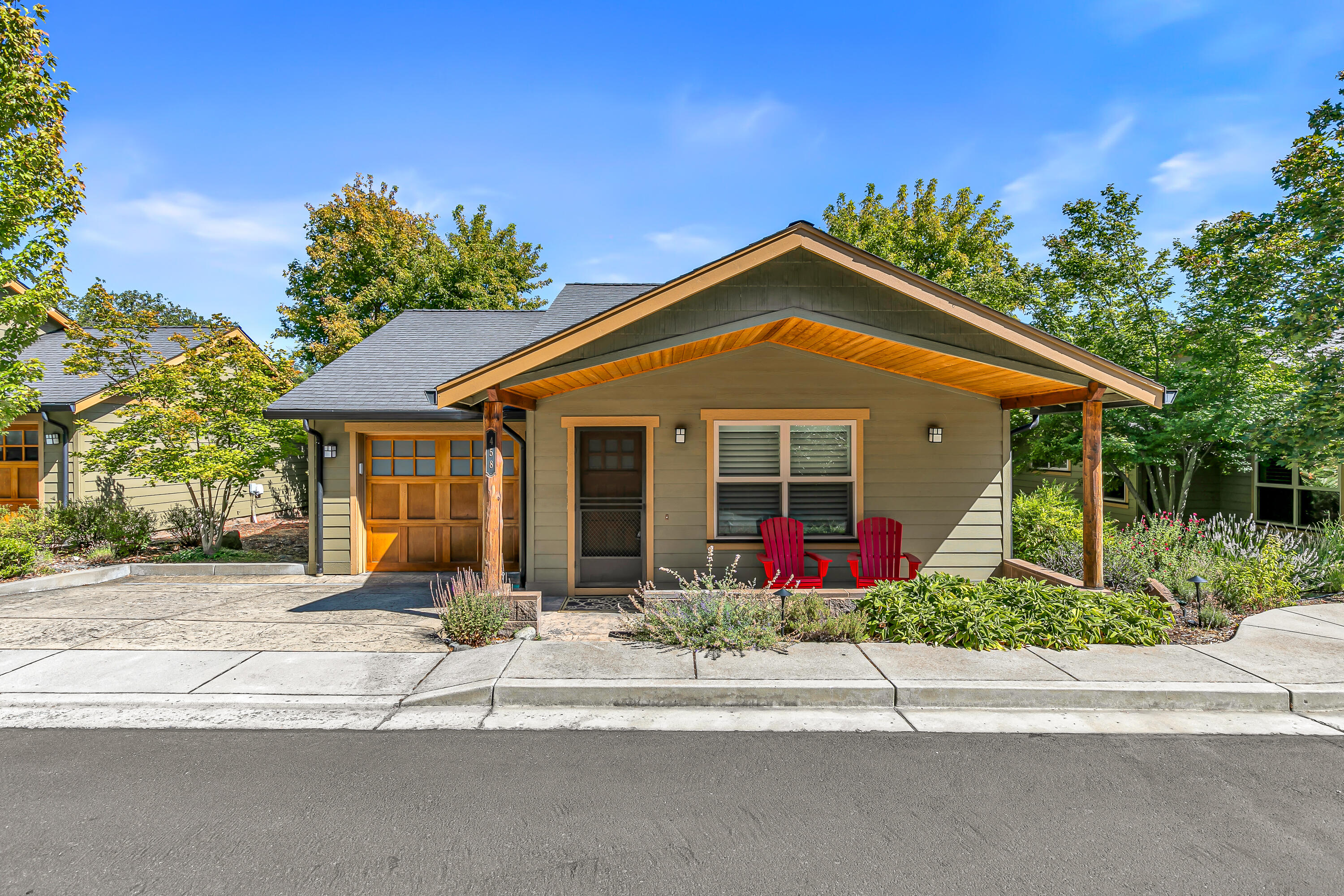 What a cozy find at the desired Beach St Cottages. This well cared for low maintenance Craftsman bungalow has it all! Only 9 units shared in this wonderful community. Enter your vaulted ceiling living room with Brazilian Cherry hardwood flooring, a corner gas fireplace and built-in TV space above that takes you away when feeling the fall coming your way or just snuggle up to a good read. The kitchen flows gently through with continued cherrywood cabinets, pantry and granite countertops, giving you all the room you need to prepare gourmet meals for family and friends. The spacious bedroom with a very oversized walk-in closet is second to none. The bedroom French doors lead you to a very private rear patio for that quiet cup of coffee or morning meditation. Enjoy the community garden/park with a fire pit and water feature always ready for evenings with friends. Low maintenance yard that is groomed by the HOA and a resident only access to SOU. Attached finished 1 car garage as well.