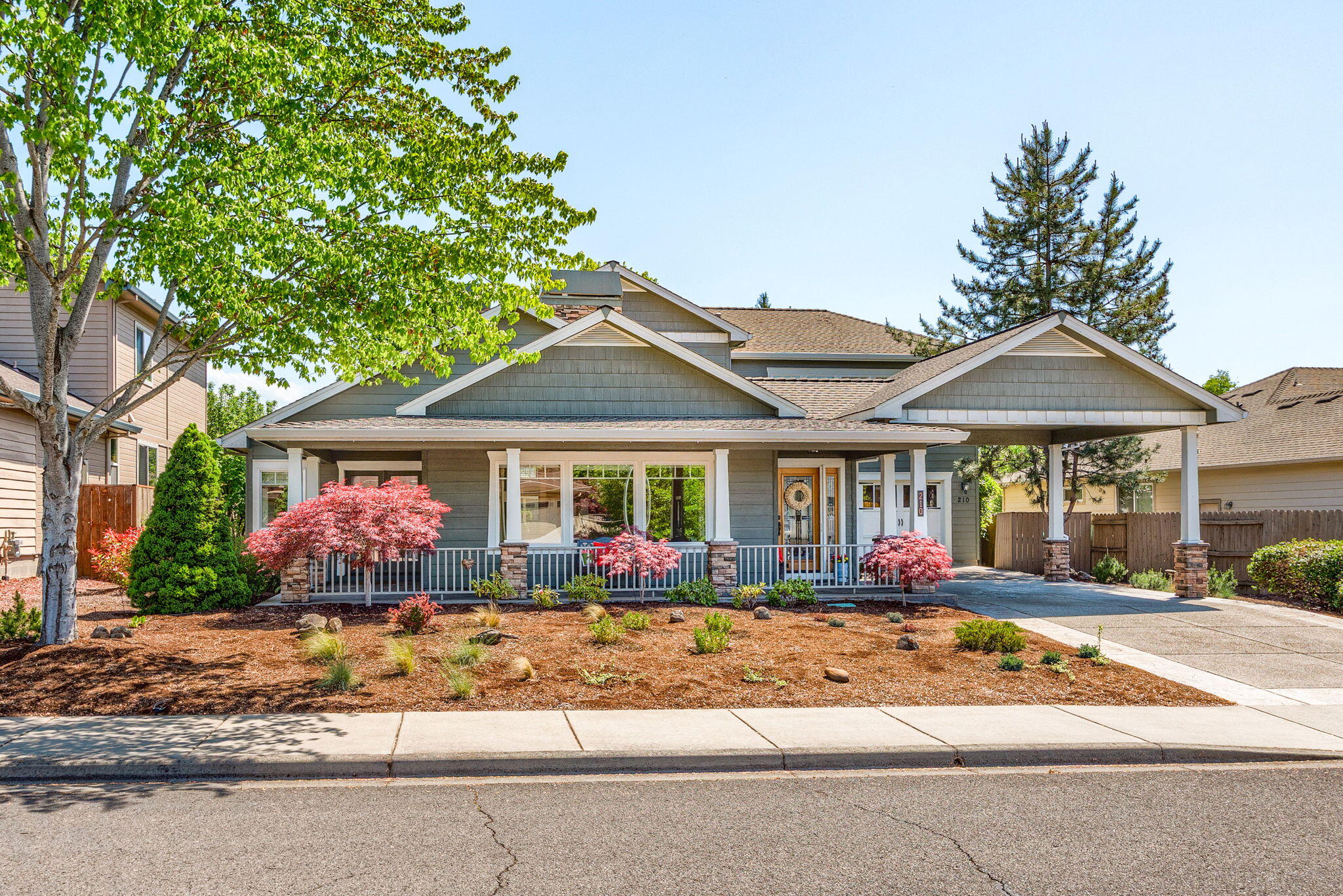 Stunning Craftsman-style luxury home just steps from the award-winning Eagle Point Golf Course. Dramatic vaulted ceilings and abundant natural light create an inviting atmosphere throughout. The spacious primary suite features a private bath and large walk-in closet, offering the perfect retreat. With 3 beds, 2.5 baths, plus an office, this home blends comfort and functionality. Hardwood floors add elegance, while a formal dining room provides space for entertaining. Two separate living areas featuring a gorgeous 2-sided fireplace give flexibility for relaxing or hosting guests. The low-maintenance yard and outdoor living areas are designed for easy enjoyment, whether for gatherings or quiet evenings. Perfectly combining refined details and everyday convenience, this property offers a premier lifestyle in one of Southern Oregon's most desirable golf course communities. All of this just steps away from exceptional recreation, dining, and the scenic beauty Eagle Point is known for.