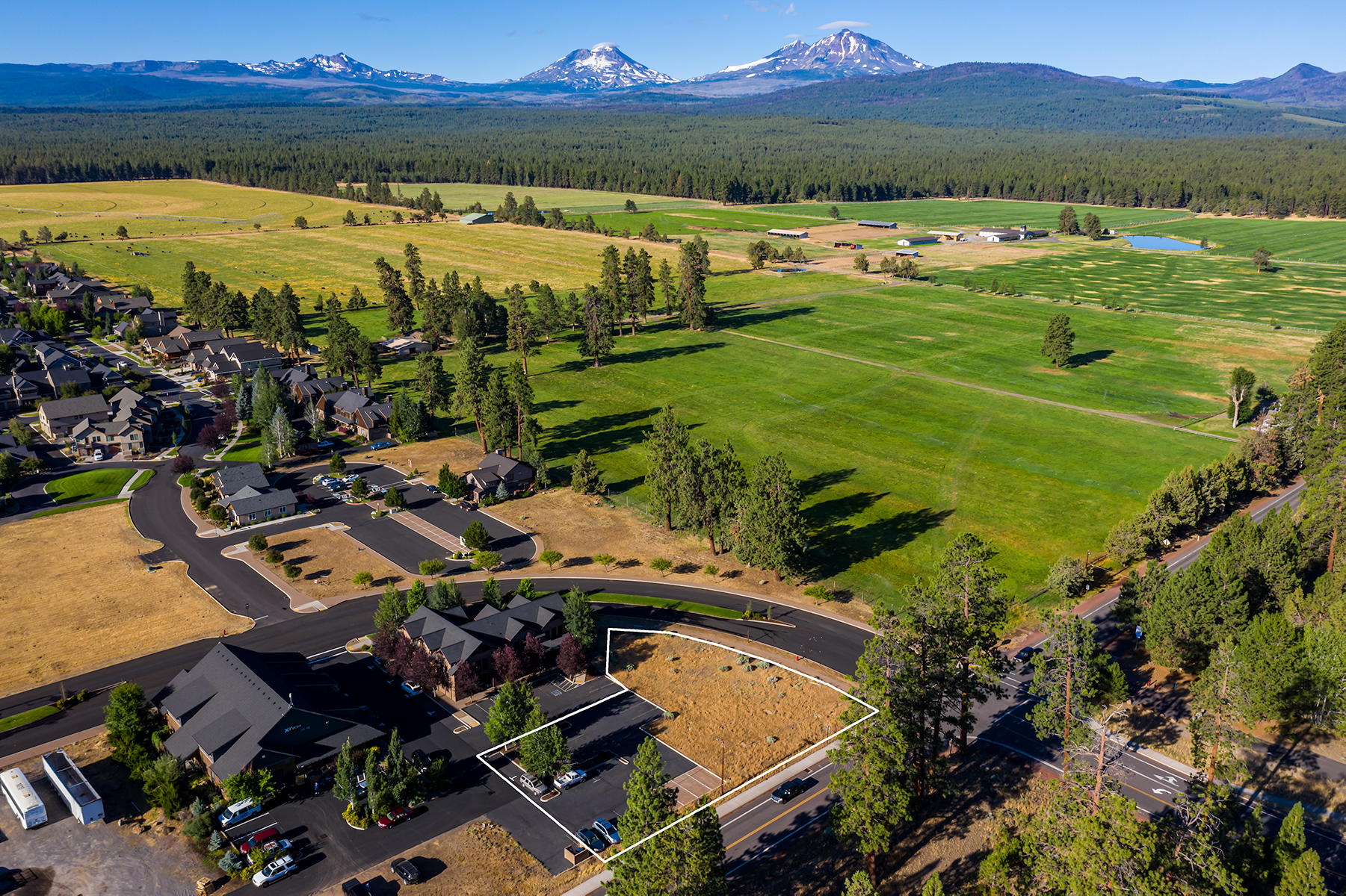 Excellent development and investment opportunity just west of downtown Sisters. This corner lot is .56 AC, has great exposure on W. Hood Ave. and W. Cascade Ave., and offers exceptional Cascade Mountain views. Downtown Commercial zoning allows for a wide variety of potential uses including office, live/work, cottages, hospitality, and & more. Walking distance to the shops and restaurants of downtown Sisters, and a short drive to hiking, biking, fishing, and skiing.