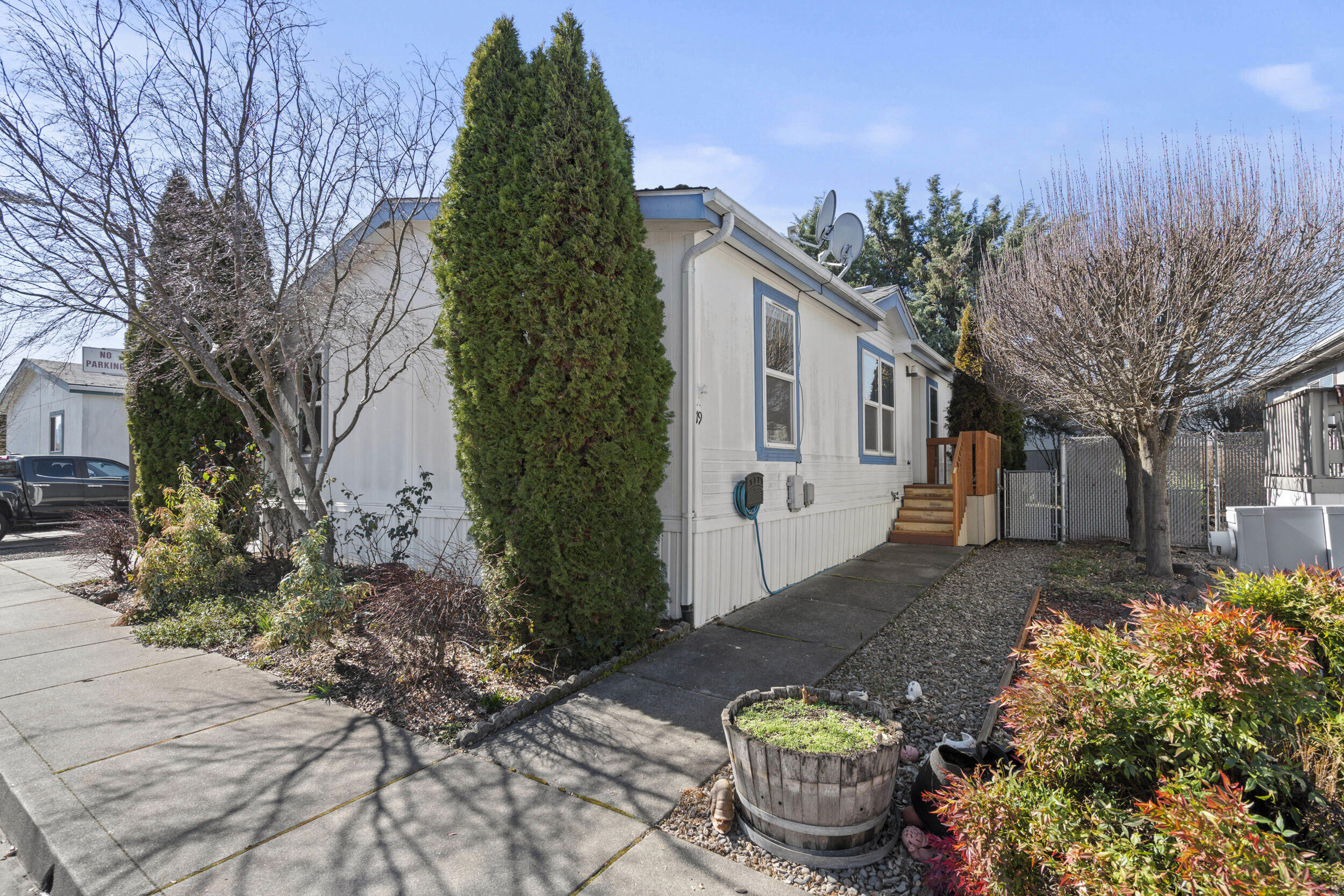 Located in the desirable Meadow View Estates, an all-ages community, this beautifully updated 3-bedroom, 2-bathroom manufactured home offers 1,296 sq. ft. of open-concept living space. Abundant natural light pours in through skylights, highlighting the modern upgrades throughout. Enjoy the convenience of a covered carport, a storage shed for extra space, and newly built front and rear decks—perfect for relaxing or entertaining. The fully fenced yard adds privacy and security, making this home a must-see!