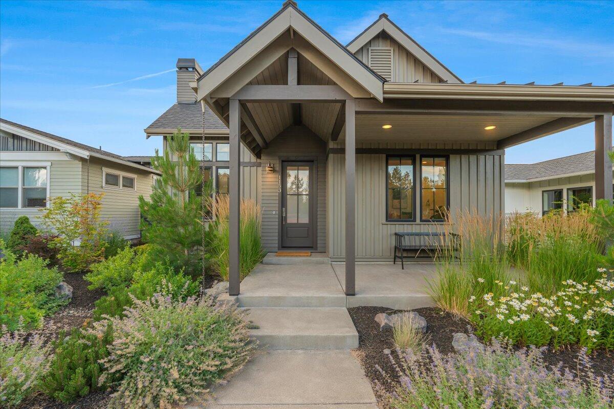 Step into modern comfort with this beautifully crafted, single-level Craftsman-style home, built with contemporary living in mind. Enjoy the warmth of luxury vinyl plank hardwood floors, sleek solid-surface countertops in both kitchen and baths, and a full suite of stainless steel appliances. An inviting private yard and BBQ area extend your living space outdoors—perfect for entertaining, relaxing, and watching the sunset over the cascade mountains. It's a great spot for al fresco dining or hosting friends and family. The spacious two-car garage offers convenient alley access. Ideally located just steps from the heart of Northwest Crossing and The Grove, this home is part of a thoughtfully planned neighborhood where convenience meets community. Enjoy walkable access to parks, trails, dining, and shops. Designed for a vibrant, connected lifestyle, Northwest Crossing creates a sense of neighborhood where people naturally gather—reducing reliance on daily car travel.
