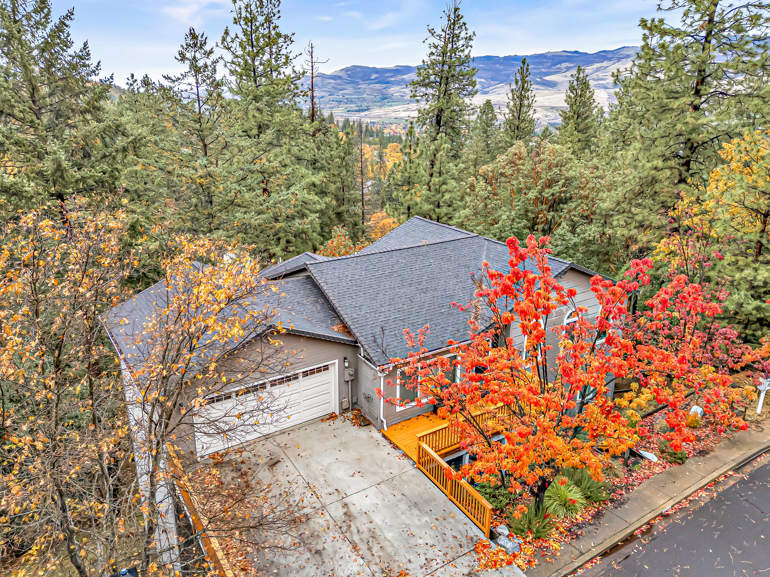 Tucked away on a quiet, tree-lined street, this beautiful home strikes the perfect balance of space, comfort, and mountain charm. Boasting 3,404 square feet, 4 bedrooms (plus an office) and 3 bathrooms, it offers plenty of room for both relaxation and entertaining. The open main level flows easily from the spacious living and dining areas to a warm, inviting kitchen with rich wood cabinetry, generous counter space, and windows that frame peaceful forest views. New front and rear decks extend your living space outdoors, perfect for morning coffee or evening gatherings. The lower level hosts the primary suite and three additional bedrooms, three with private deck access and peaceful vistas. A large basement provides easy access to nearby trails and could be finished for extra living space, while also offering convenient access to the home's major systems. With a clean pre-listing inspection and thoughtful updates throughout, this home truly embodies refined mountain living.