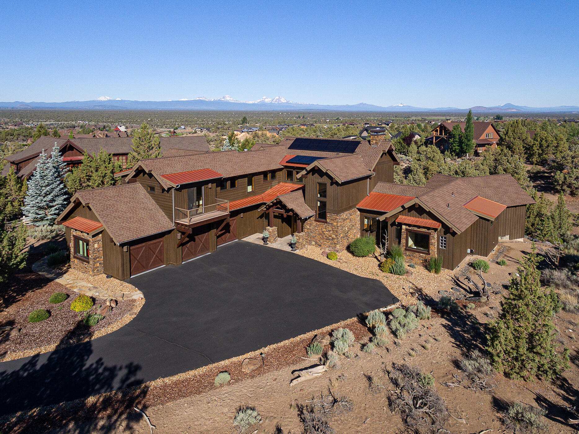 Life at Brasada Ranch is an extraordinary experience made even better by this luxury home. Step into the sunny great room with huge Cascade Mountain views leading to outdoor living on the extensive deck. Love entertaining with the open floor plan and cozying up to the stone fireplace, cooking in the gourmet kitchen and coffee in the breakfast room with views you want to wake up for. The office and gorgeous primary suite are on the main floor, with the  loft and 2 en suites upstairs, creating nice separation for guests. Energy efficiency is maximized with a 2019 solar panel system, Tesla car charger, upgraded WIFI and remote-controlled heating system, and new air purifiers for both furnaces. Enjoy Brasada Ranch amenities (membership required at addl. cost) and trails, and your easy going, yet 5-star lifestyle.