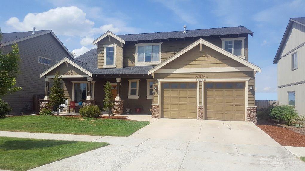 Craftsman style home w/4 bedrooms, located in Traditions East. Quick & easy access to all the eastside shopping, restaurants & Costco. Light and bright with 2 story vaulted ceilings in the entry & living room, kitchen with stainless steel appliances, eating bar & walk-in pantry and open to the great room with gas fireplace. Vaulted master suite with spacious bathroom, soaking tub and walk in closet. Complete with A/C, oversized 2 car garage w/storage racks & private fenced backyard with paver patio.