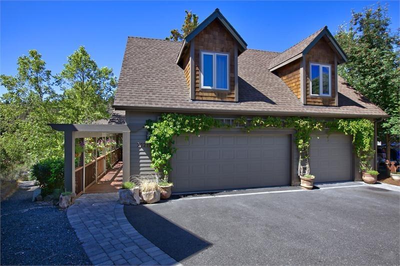Unparalleled Deschutes River setting in town! Soak up the panoramic views of the Deschutes River from almost every window. Spectacular 2688 sq/ft 3 bedroom 2.5 bath contemporary home. Featuring, rich oak hardwood floors, Montana stone fireplace, vaulted ceilings in the living room, beautiful custom cabinetry, slab granite countertops in kitchen, stainless steel appliances and butler pantry. Wonderful master suite with private outdoor space. BBQ deck off of the dining room and an expansive paver patio off of the family room. Additionally there is a 698 sq/ft private guest quarters with 2 bedrooms and 1 bathroom above the garage. 3-car garage with half bath and large, conditioned & lockable storage space under the home. Located in a gated community of 20 homes with tremendous privacy, this really is a special place.
