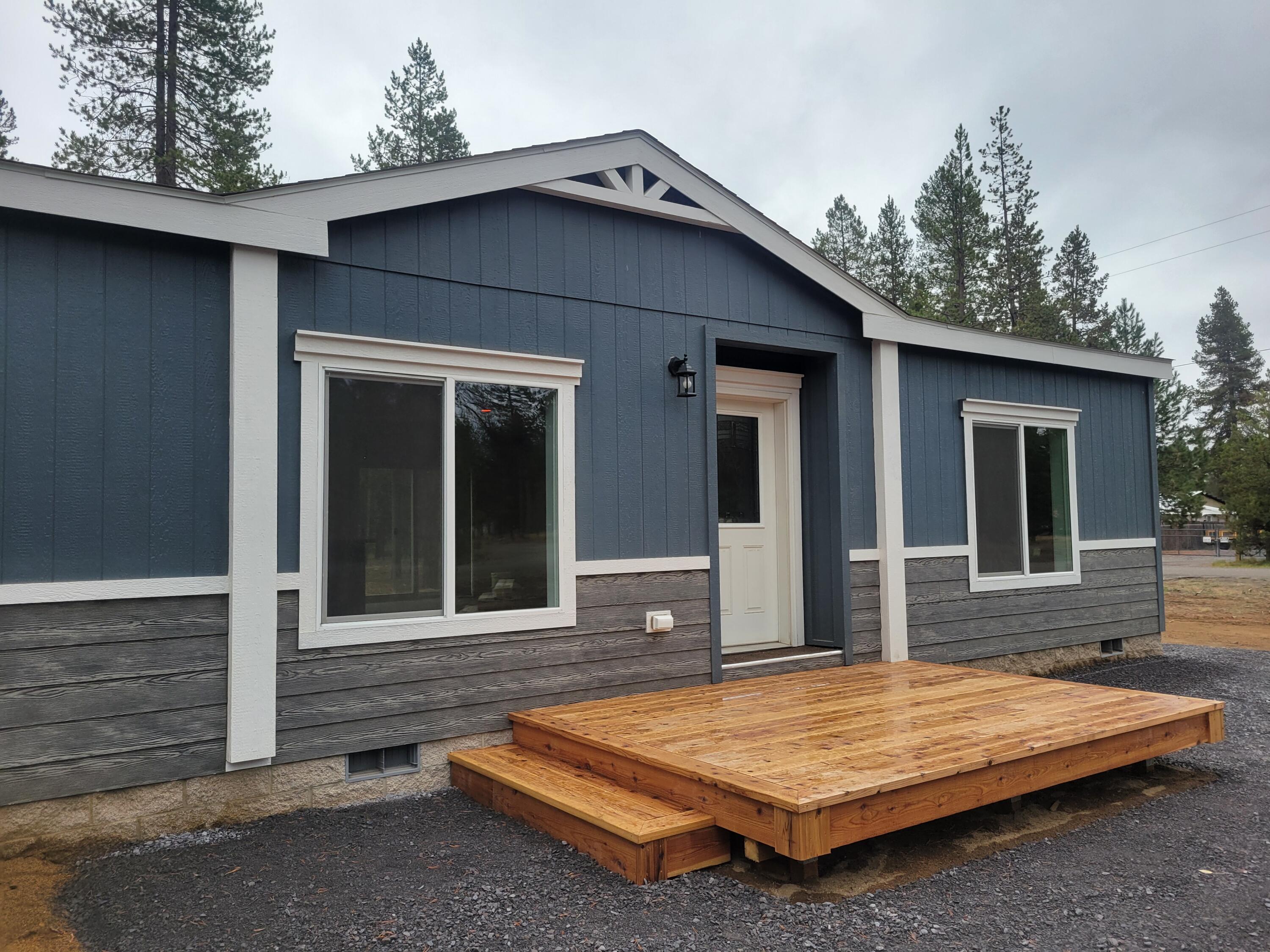 Welcome Home to your brand new 1608 sqft. 3 bdrm/2 bath manufactured home on .95 AC corner, wooded lot near 
Pringle Falls & Cascade Lakes & Resorts! Country living but near shopping, medical, city conveniences, La Pine State Park, East lake, Paulina Lake, Wickiup Reservoir. New well & ATT Septic System! Primary ensuite separated from guest quarters w/dual vanity, soaking tub, enclosed toilet. Open concept Great Rm w/Kitchen island, Stainless appliances & a hidden, BIG pantry. All bdrms w/ walk-in closets. Large windows bring in the outdoors & wooded views.
Lots of counter space & storage for you to organize, prepare your tasty meals & entertain! Cedar front & back decks. Graveled, Circular driveway! RV Parking, Room to build a shop!  No HOAs!