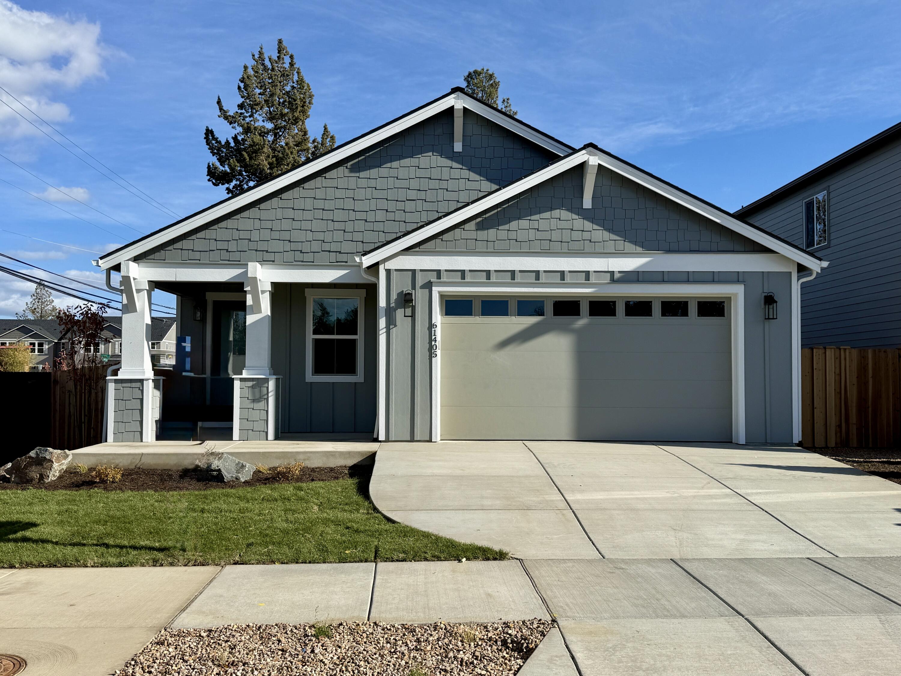 This stunning single-level home in Sunset Glen by Stone Bridge Homes NW truly checks all the boxes. Designed with comfort and style in mind, this home features hardwood flooring throughout the main living areas, quartz countertops, and stainless steel appliances that enhance the modern kitchen. Bathrooms and laundry areas are outfitted with elegant tile flooring. Enjoy cozy evenings by the gas fireplace, featuring a striking floor-to-ceiling tile surround, and experience year-round efficiency with a tankless water heater, Nest thermostat, and Ring doorbell—step outside to a large covered patio and spacious backyard, perfect for entertaining or relaxing. The home features full fencing and landscaping for both the front and back yards. Certified Earth Advantage for energy efficiency and sustainability, and backed by a 2-10 Home Buyer's Warranty,