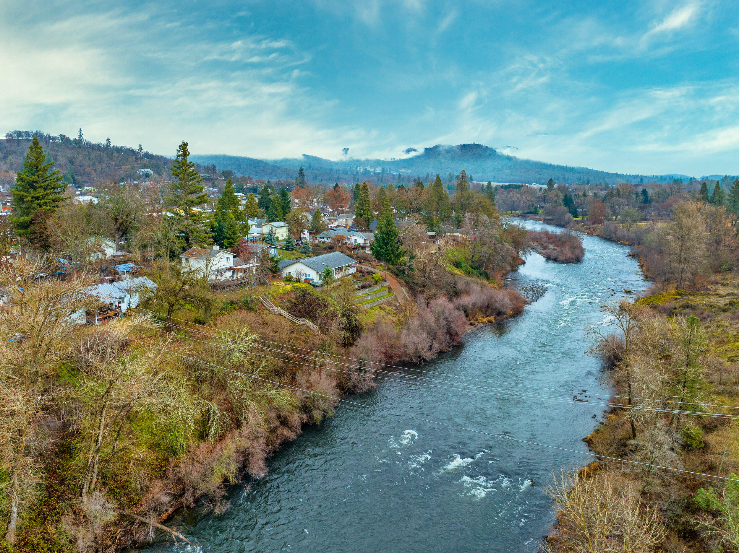 Riverfront duplex with over $50k in recent upgrades & renovations! This is a rare opportunity for an income property along the renowned Rogue River. Consists of a 2 bed/1 bath unit & a 1 bed/1 bath unit, each with inviting river view settings & efficient layouts. Unit 582 recently had extensive renovations, & Unit 584 has a long term tenant. This property offers an investor a sound investment & has lots of upward potential by obtaining market rent for both sides or possibly doing short term rentals through AirBnB, VRBO, or other platforms. Buyer to perform their own due diligence on approved city uses. Gold hill is a quaint river-town that provides easy travel via Interstate 5, as well as a direct route to Sams Valley, the TableRocks, & further to Hwy 62 & Crater Lake National Park. Upgrades include new windows, electrical subpanel, and ext. Paint for both units, & new interior paint, baseboard heaters, water lines, kitchen countertops, flooring, & much more in Unit 582