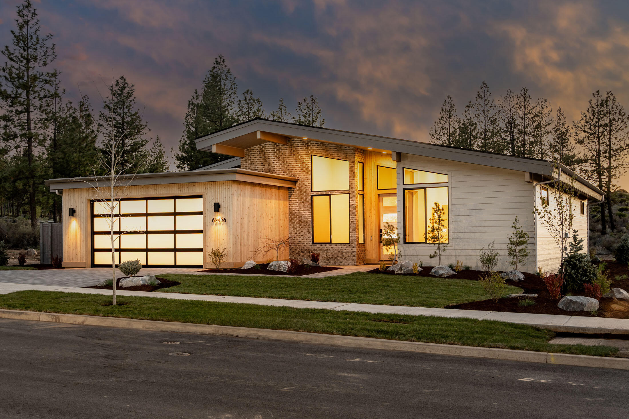 This spectacular mid-century modern home built by Rundle Construction and Development, Inc. in Shevlin West has it all. Single level, mountain views, backing up to protected land out the back, 3 bed/3bath, 2 master suites, extensive hardwood and tile work, Thermador appliances, custom cabinets, prewired for entertainment, oversized 2 car garage, paver driveway, paver patios, custom firepit, fully landscaped, too many features to list. There is not another comparable home and location in Bend at this price range.
