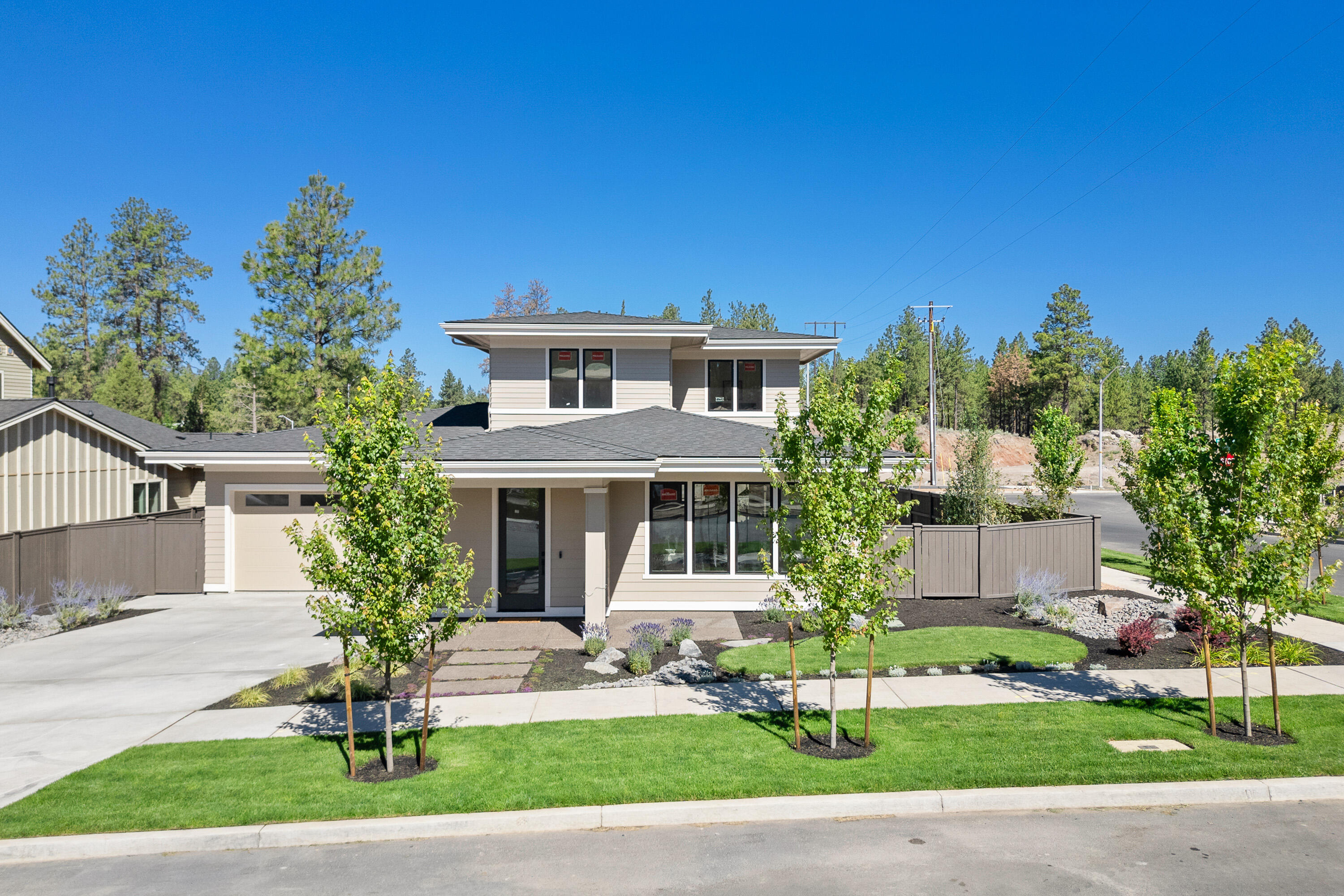 Welcome to this stunning Northwest style home in Talline, cleverly designed by MCD Homes. As you enter this highly functional 4-bedroom dwelling, you are greeted by a spacious great room off the foyer which also leads out to a quaint den. The kitchen is equipped with top-tier solid surface counters, an expansive island for meal preparation, and a generous pantry for storage. At the rear, discover the primary suite with dual vanities, exquisite tile shower, and spacious walk-in closet for added luxury. The main level houses a second bedroom, while the upper level boasts two further bedrooms, sleek bathroom and bonus room that's all set to be transformed to meet your lifestyle needs - may it be a home office, a gym or a playroom. For outdoor lovers, this house offers a large covered back porch, an ideal spot for a quiet mid-morning coffee or alfresco dining in the evening. This home brilliantly marries design and functionality, assuring its new owners a tranquil yet sophisticated living