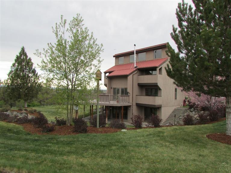Beautifully landscaped property with paved driveway and Cascade Mountain views. Solar passive home has 4 bedrooms, 3.5 baths, multiple decks, finished daylight basement and open living areas. Kitchen, dining and living room open to a large entertainment deck. 2760 sf shop with roll up door and RV drive through. RV dump and hook up station. Master on main floor and plenty of storage space. Raised garden beds, fruit trees and roses adorn this beautiful yard.