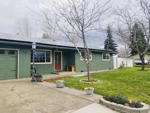 Welcome to this lovely home in Eagle Point. This updated home features 3 bedrooms and 1 ½ bathrooms on .21 corner lot. Both bathrooms have been completely redone. Kitchen has granite countertops with custom cabinetry. Home has double pane vinyl windows throughout and new roof was installed in 2017. As you step outside onto the landscaped patio under the pergola you will be pleasantly delighted. There is a firepit for entertainment and smores! There is also RV Parking with electric hookup. Home is completely fenced with one car garage. Laundry hook ups are in garage.