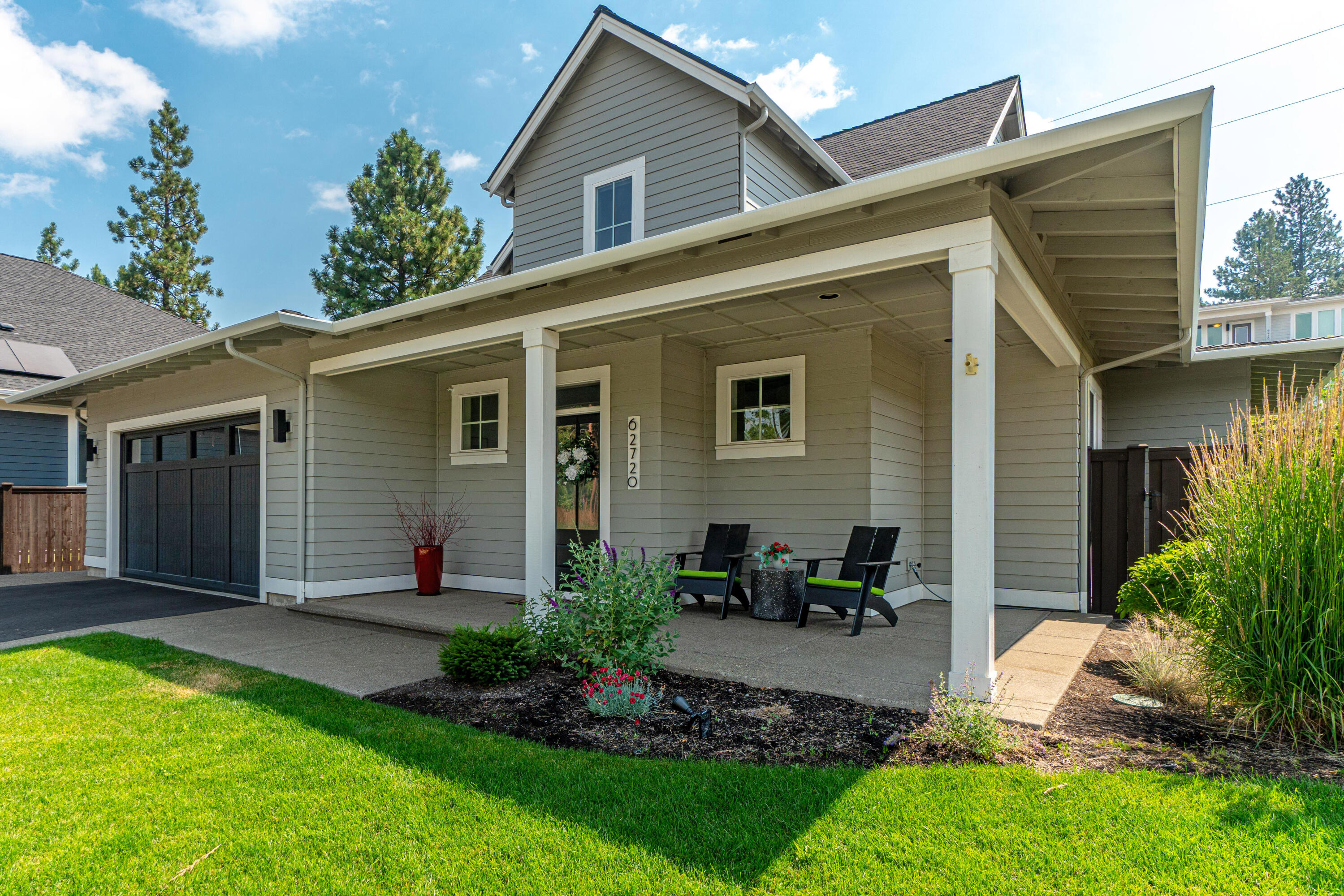 Experience the perfect blend of modern farmhouse charm and convenient living in Shevlin Bluffs. Crafted by award winning builders, Structure Development NW, this home is on a rare corner lot near Shevlin Park on Bend's west side where you will have easy access to parks and trails, and the popular restaurants and shops of NW Crossing. Here, you are welcomed by an inviting open floor plan, where a spacious great room awaits with a newly remodeled gas fireplace and hardwood floors that flow throughout the main living area. The kitchen is a showcase for stainless steel appliances, custom cabinetry, solid surface quartz countertops, and modern lighting. Primary suite on main level, and two guest bedrooms, large family room and full bathroom on upper level. Relish in the tranquility of the covered front and back porches. The beautifully landscaped yard offers both privacy and a picturesque setting. Make this remarkable modern farmhouse-style home your own. Earth advantage certified.