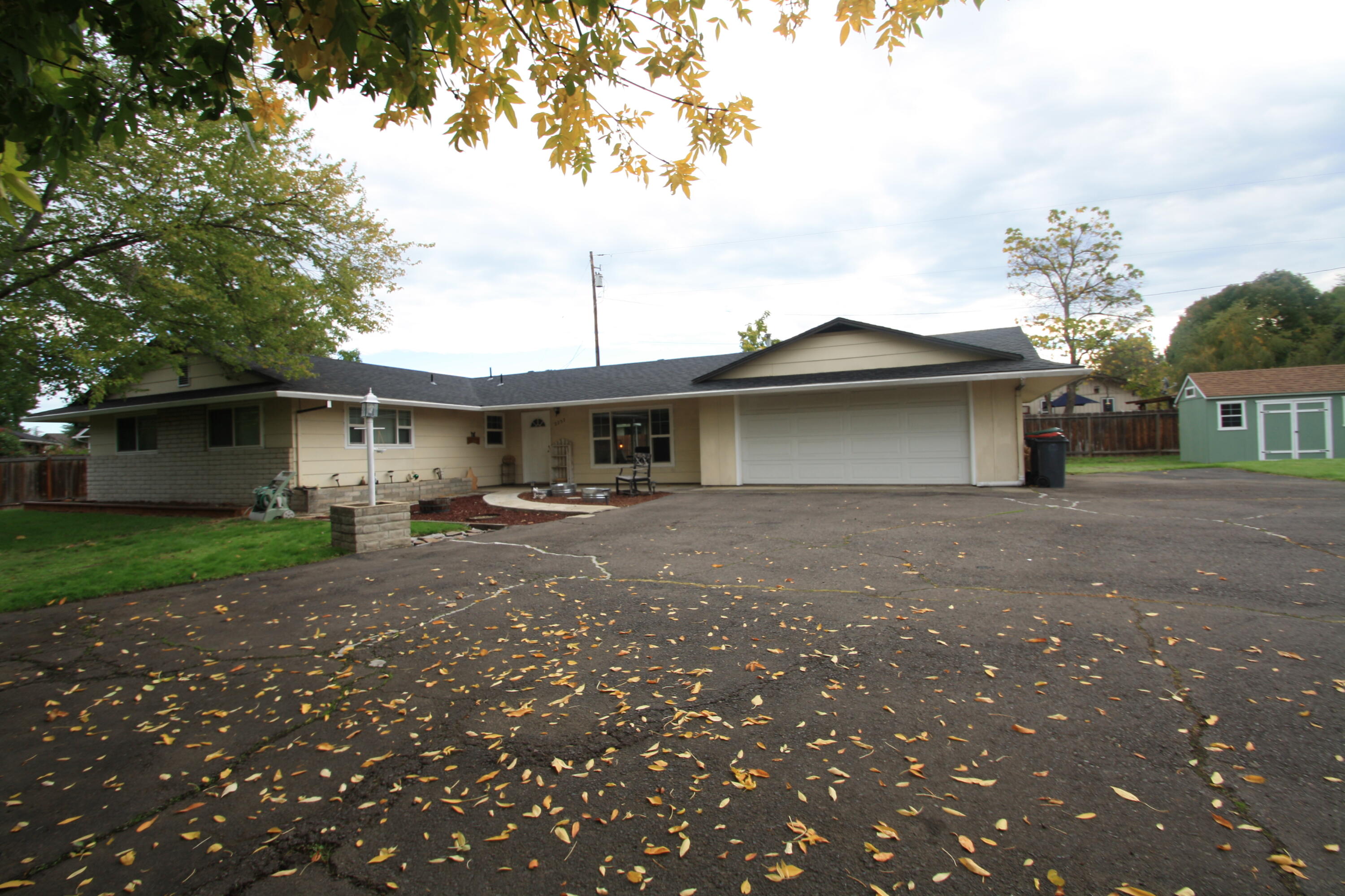 ATTENTION BUYERS!  This spacious .47-acre lot offers plenty of space for multiple opportunities. The City has suggested there is a potential of adding an ADU (buyers do due diligence). Located near North Medford High School, this 1443 sq/ft home has 3 bedrooms & 2 bathrooms. Step inside to the inviting living room and dining room which features 3/4'' hardwood flooring. Newly installed French doors that create a seamless transition between the primary bedroom and the backyard. Another bedroom also features its own French doors leading to the backyard. All bedrooms are good size & one bedroom (and hallway) has new carpet. The yard offers a sense of privacy, a newer shed & ample space for RV parking. Seller will contribute up to $2,500 towards closing costs, pre-paids and rate buy down.