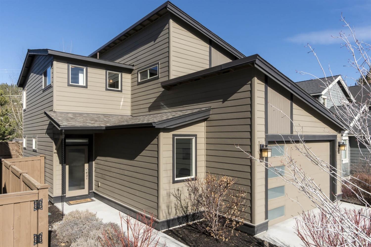 This stylish & modern 3 bed 2.5 bath home by award winning Pahlisch Homes boasts quality finishes & appliances, A/C, a beautiful gas fireplace and a great room concept - all with a great NW side Bend location where you can walk/bike to coffee, shopping, restaurants & trails. Lightly live in and immaculately cared for, this is the perfect home for simple living & ease of maintenance. This is an opportunity not to be missed.