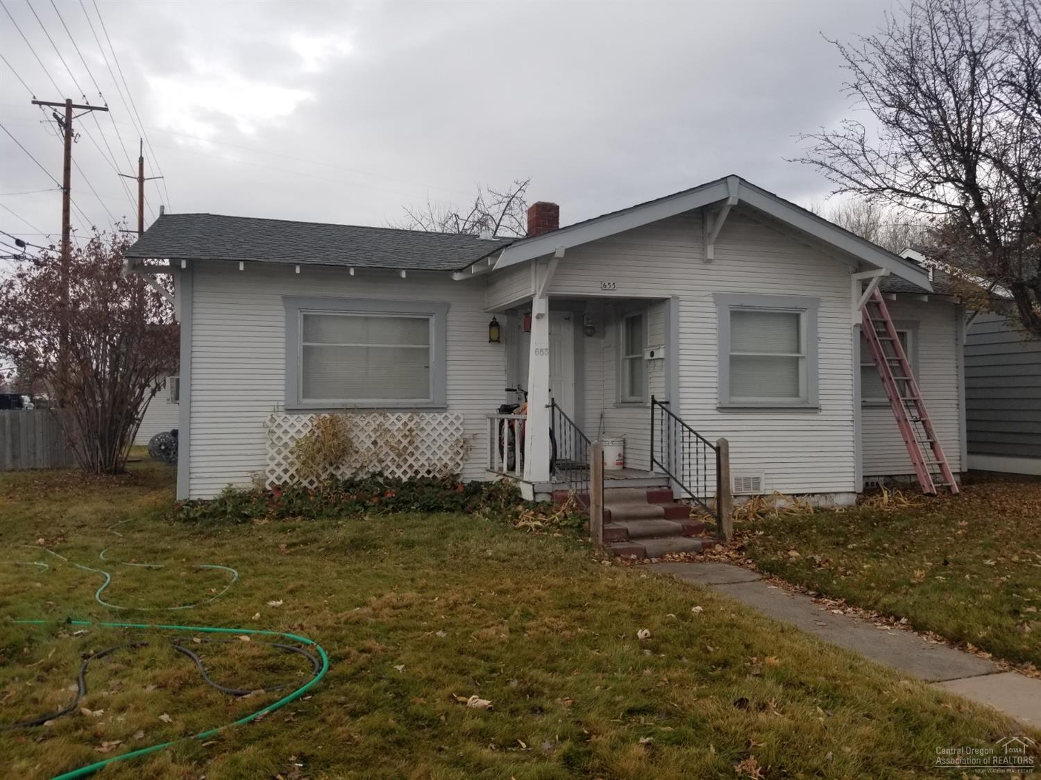 Front home is 1074 sq ft single level, living, 2 bedrooms plus a bathroom, kitchen with nook area off to the side. There is a larger area in the back off the kitchen that the renter curerntly uses as a bedroom. Coming in the back door is another area they have stored items in. Home has utility and mud room. New gas heaters have just been installed. Secondary living out back 456 sq ft. One bedroom, small living with kitchen, newer cabinets and sink. Extra storage attached to this building. Old and not in very good condition. See County Historical Society.