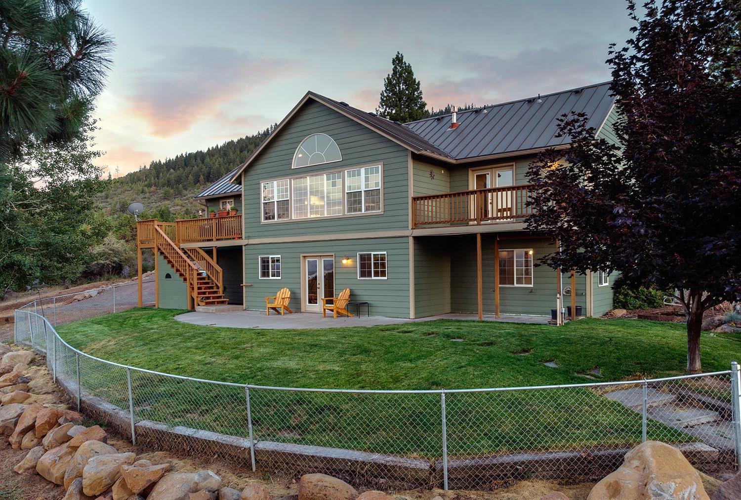 Wow! When you walk into this custom built home a panoramic view of Klamath River basin will take your breath away! Built with quality construction throughout, this home has a wonderful floor plan design-2 bedrooms (including the master) on the main level and a 3rd bedroom + bonus room with closet, bath and family room downstairs. Built with extended family living in mind (wide hallways and stair tram.) Situated on 5 acres with filtered trees. Attached 3-car garage (double with one side two-car deep) plus detached 24x24 heated SHOP/Garage, a greenhouse, chicken shed, plus fenced garden area and RV parking pad. Here's the peace and tranquility you've been looking for, with only a 20 minute drive to town. Don't miss viewing this one!