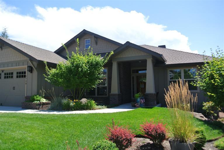 light and bright,welcoming and warm... This single level, split floor plan home is one of those I gotta live here houses. Lots of windows, high ceilings, hardwood floors, tile and granite. master bedroom and bath are on one side of the home with 2 bedrooms and bath on the other. Large dining room could be sitting room or office/den. built in temperature controlled wine storage, custom built cabinets on either side of the fireplace and custom built pantry. the garage is over sized with workshop area or extra storage.