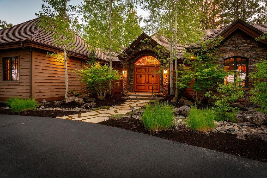 An unparalleled, private setting and an exquisite architectural design situated on 10 ACRES in the heart of Bend's Westside! Located in the exclusive community of The Highlands, this custom home offers SINGLE LEVEL living surrounded by the High Desert landscape, serene water features and stunning outdoor spaces. Spacious Great Room offers warm wood accents, stone flooring and elegant gas fireplace. Formal Dining w/extensive built-in cabinetry & direct access to multiple back patios blends indoor/outdoor living seamlessly. Chef's Kitchen features solid surface countertops, professional grade stainless appliances and Butler's Pantry. Family Room w/informal dining and gas fireplace is the ideal space to gather. Home office w/access to front patio. Private Primary Suite features spa-like bath, 2 generous walk-in closets, sauna and secondary home office. 2 En Suite BR on main + additional flex space + home gym. Upstairs: 4th en suite. Moments to all Westside schools, trails and amenities.