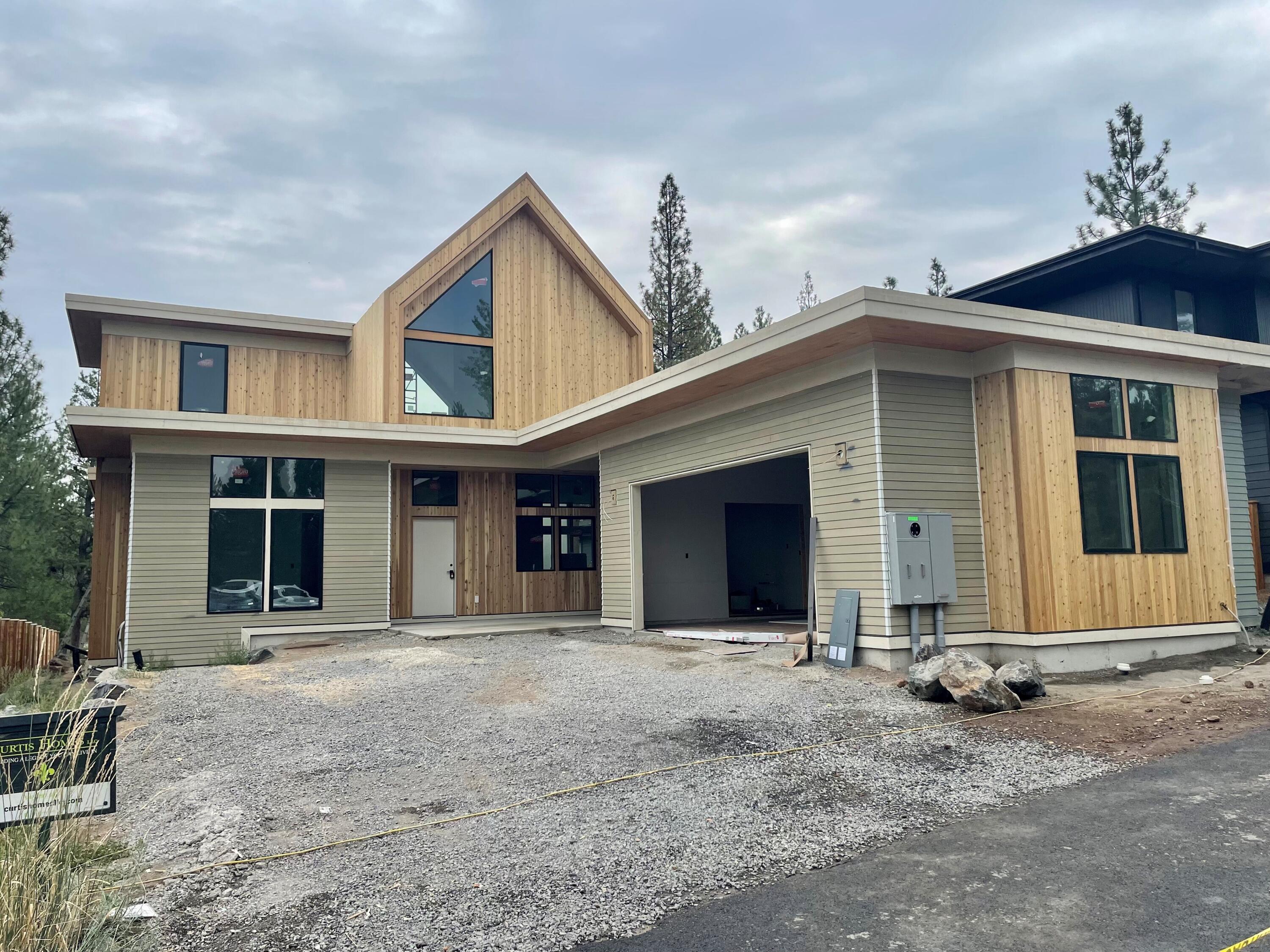 $20,000 Fall Savings Special! Curtis Homes to credit Buyer up to $20,000 for Buyer's closing costs, rate buy-down. Ask us how our preferred lender can provide even more savings. This stunning contemporary design by COBA award-winning Curtis Homes showcases a 2995 sf main house and a 528 sf detached ADU. The main home includes 3 bedrooms, 2.5 baths, an office, a spacious loft, and a primary suite on the main floor. Enjoy the stylish island kitchen equipped with a complete stainless steel appliance package and refrigerator. Custom cabinets, soft-close drawers along with quartz countertops. The spacious open floor plan fosters a seamless flow between spaces. The ADU mirrors the elegance of the main home, offering matching finishes, a delightful kitchen, and a complete appliance package, along with a bedroom and a full bath. The commitment to Earth Advantage energy efficiency standards by Curtis Homes and Outcrop enhances the allure of this residence.