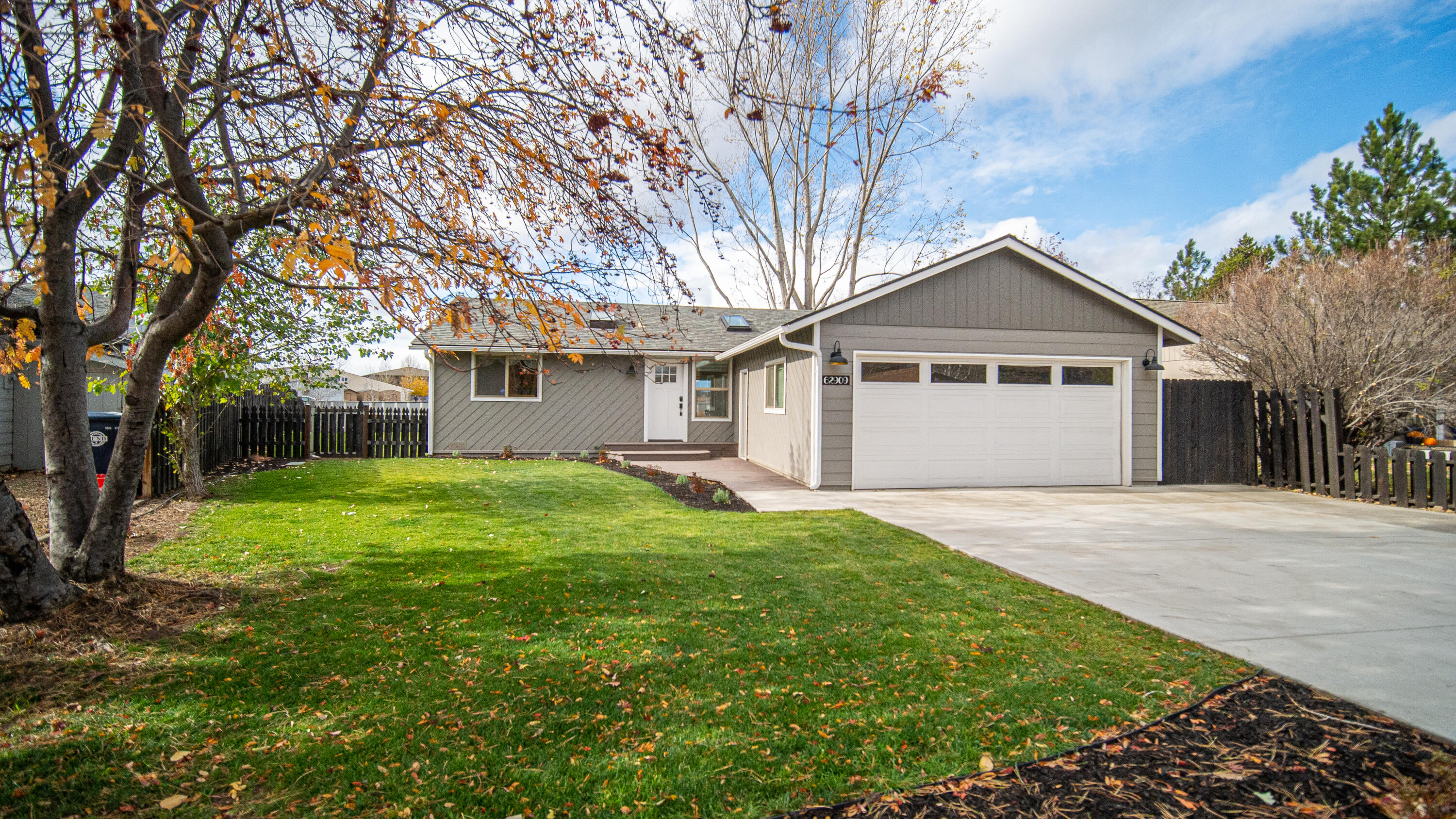 A Modern newly updated charmer! Single level home, 3 bedrooms, 2 baths, with fully fenced yard and Cascade Mountain views. All new updated kitchen with leathered granite counters, cabinets, SS appliances, new wood laminate flooring throughout the entire home, updated lighting fixtures, ductless mini split heating/cooling system, interior and exterior paint! Bathrooms updated too! Vaulted ceilings make the great room feel spacious. The living room, master bedroom and back deck face the west with amazing Cascade Mountain views and Pilot Butte!  All new landscaping front and back with sprinkler system.  2 car garage and large lot! It's almost like having a brand-new house! What more can you ask for?!