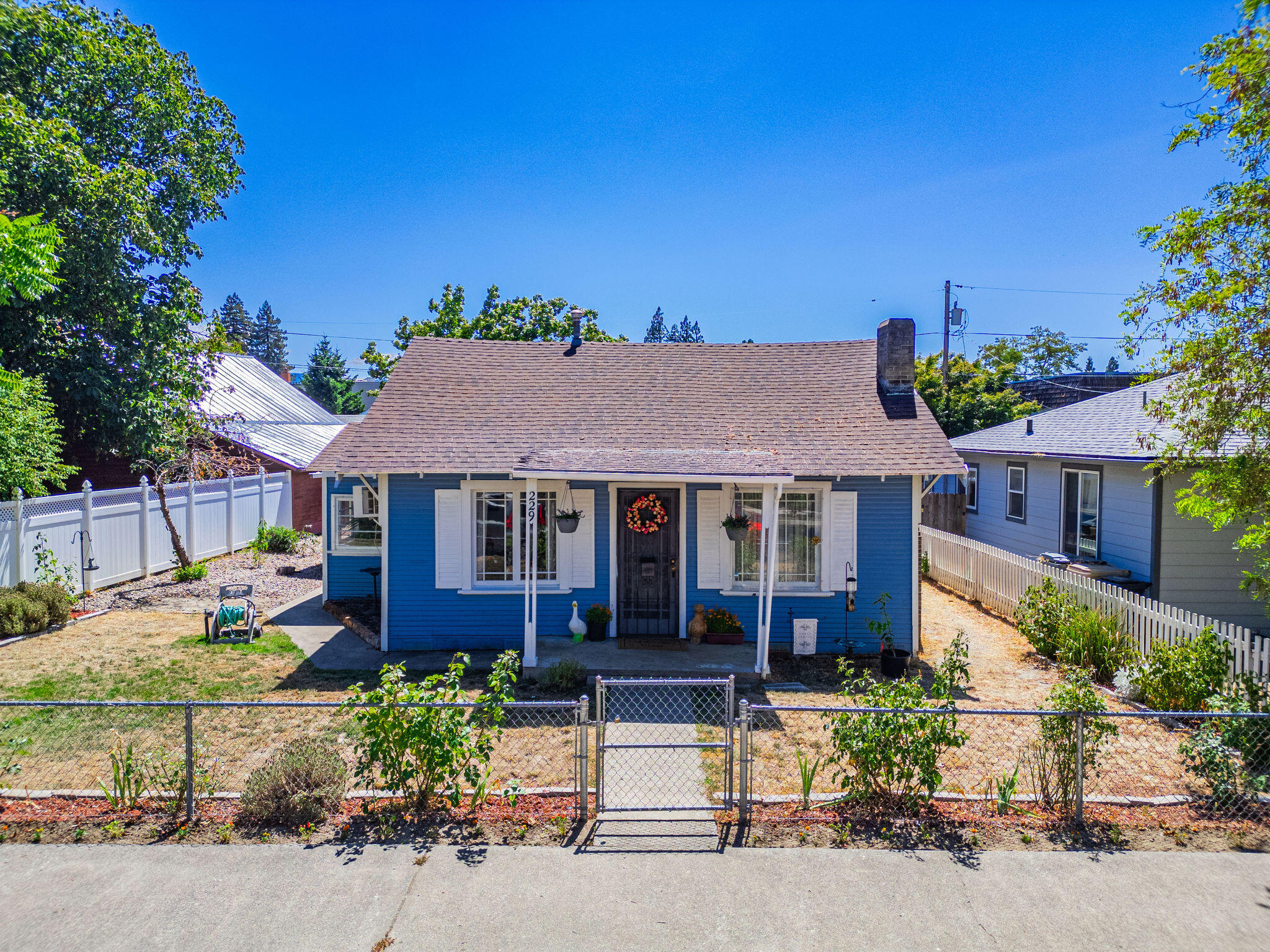 This inviting 2-bedroom, 1-bath home is the ''perfect starter or investment property''. Enjoy the fully fenced yard with beautiful gardens, offering both privacy and outdoor enjoyment. Convenient dual access from both the front and rear of the property adds extra functionality. Don't miss out on this great opportunity - schedule your showing today!