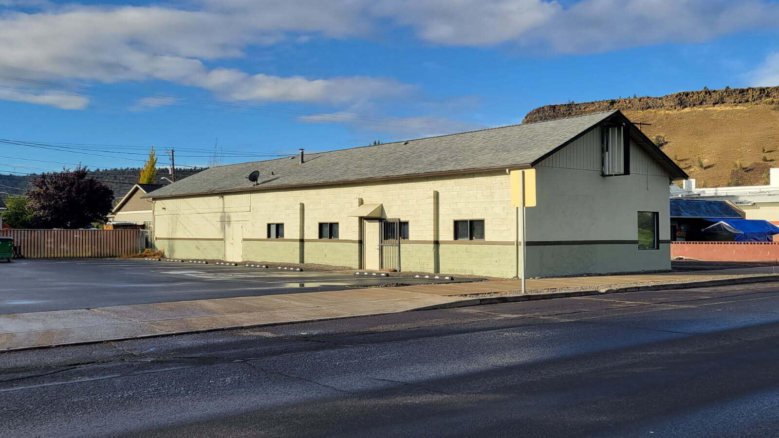 Rare opportunity to own a commercial building on 3rd St/US Hwy 26 in Prineville. This 3,000 sqft building is an open slate for a variety of uses and possibilities in this growing community. The building has been well maintained inside and out. It has gas heat, bathroom, upgraded electrical and a new roof in 2020. Rain gutters on each side. Recently (June 2025) the parking lot was paved, enhancing the curb appeal and offers plenty of off street parking. Security gate/door over main entrance. Additional double door entrance and a roll up door on west side. Both the inside and outside have been recently painted. Property is in very good condition and is in an excellent location for both visibility and access.