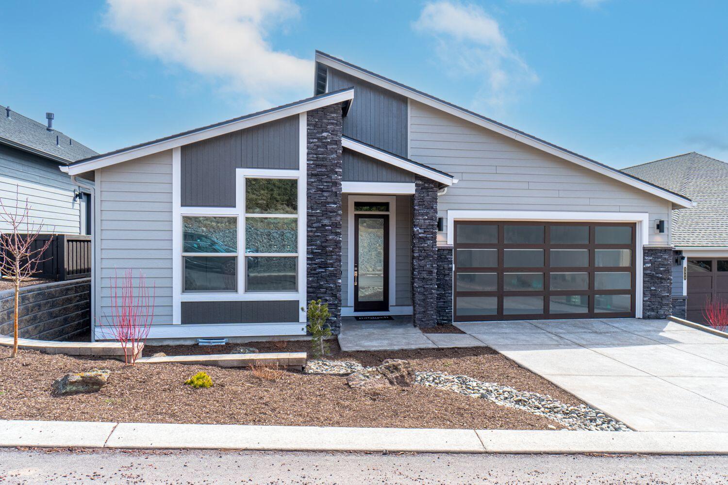 MOVE IN READY!! Beautiful Wentworth plan by award winning Pahlisch Homes  $10,000 Buyer Bonus for using builder's Preferred Lender!

In this friendly River's Edge community, you'll meet your neighbors out walking their dogs during your evening stroll.

Located on Bend's prestigious northwest side with beautiful easterly views offering a front row seat to view the fireworks off Pilot Butte. Those living here are in close proximity to the Bend Park and Recreation District River Trail, Sawyer Park, shopping, and have quick access to the rest of town.  Walk to the River's Edge Club house and driving range. 

Homes in this community are crafted with integrity and quality in mind, including smart home integrations.

2,149 SF single level will delight all the senses with the natural light, beautiful chef's kitchen, dining & great room. Relax in the Gracious primary suite with large walk-in closet, tile walk-in shower, dual vanity & soaking tub.

This home has been virtually staged