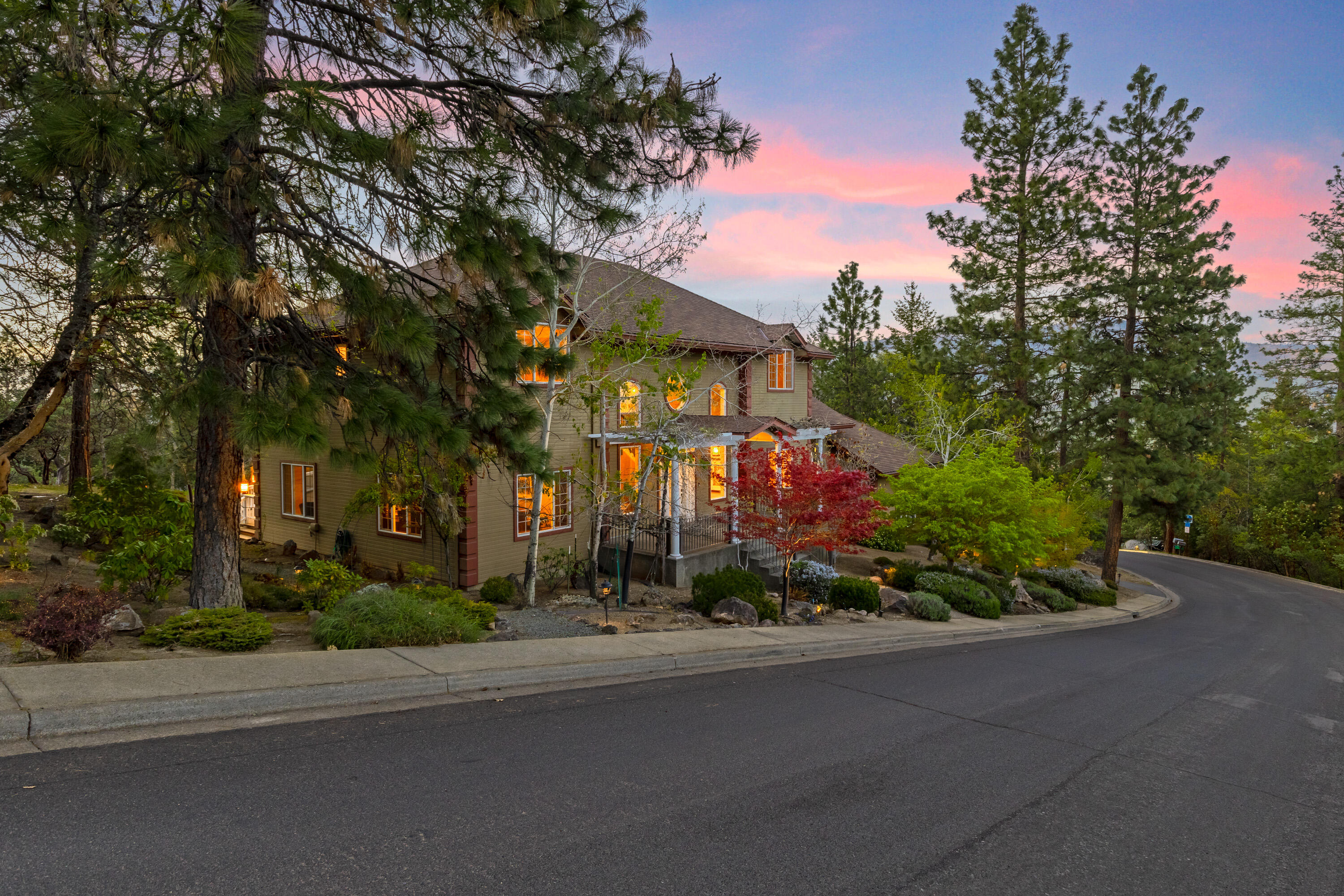 Elegant updated spectacular home w/ great location .40 acre lot w/tall evergreens. Beautiful landscaping w/ large patio, water feature, large covered porch w/views, close to trail system. Dramatic entry w/high ceilings and double-sided staircase w/ open railing & crown molding through out. Wood floors, excluding the bathroom which have tile floors. Library w/wood box beam ceilings and built-in book cases. Formal dining room w/crown molding. Open Chefs kitchen w/dbl ovens, Wolfe cooktop, sub zero fridge, Miele built in espresso, lg island & deep farm sink. Red Dragon counters, wet wine bar off the great room w/ fireplace & large windows. Cozy family room w/built in speakers. Lg master suite w/sitting area & fireplace. Dbl sinks w/granite counters, lg tile shower, separate tub, second master suite. 3 car finished garage w/work area, storage room & RV parking on the side of garage. Beautiful property w/many improvements including a roof in 2016, newer HVAC, dbl on demand water heaters.