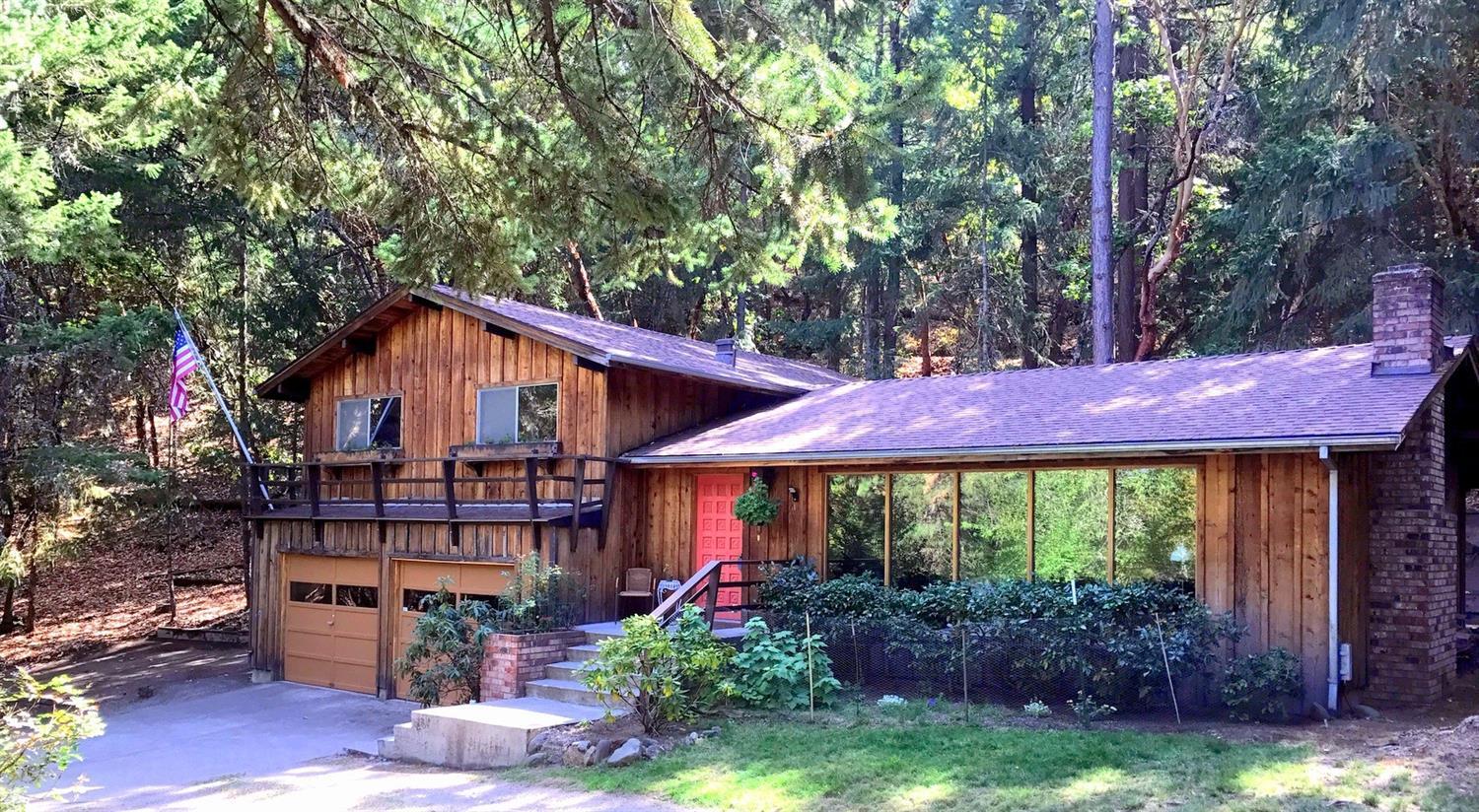 PRICE REDUCTION! New interior paint, newly cleaned. This split-level, ranch-style home offers 3 Beds & 3 Baths. It is located in a cul-de-sac in a private, forested setting in a sought-after, above the boulevard neighborhood near Southern Oregon University. The home, of approximately 1992 Sq Ft has an enchanting chalet look, accented by second story window boxes. With views of nature in all directions, this home has full length windows in the open living/dining areas, hardwood floors, open-beam ceilings. It offers a cozy fireplace for wintery days & a new cedar deck surrounded by oaks, pines, madrone, flowering shrubs, wild flowers & bird songs for all seasons. Spacious garage with a large workshop, office & a full bath.