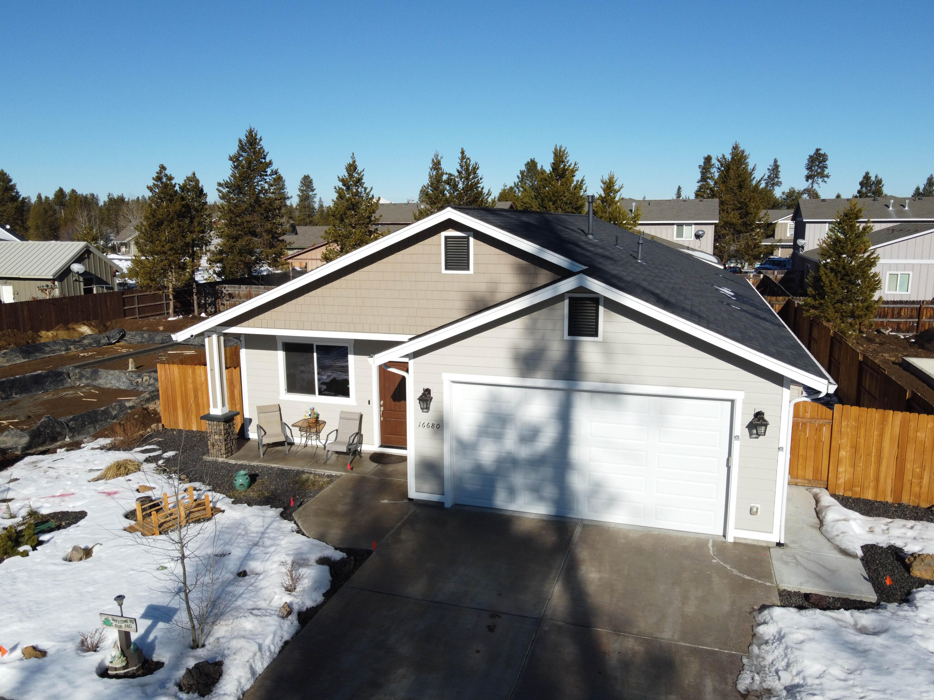 Consider this 2018 custom built 3 bed 2 bath 1704 craftsman style single level home! A great opportunity to own a 1 owner home-like new. Located on a quiet street one block from Finley Butte Park. Anyone could love this open concept home with luxury vinyl flooring throughout the main living area & bathrooms. Home also includes a natural gas fireplace in the great room, cozy for cool mornings and evenings! Kitchen has stainless steel appliances with granite countertops & soft close cabinet drawers, large pantry, ample storage, and boasts a nice island with seating & eat at bar. Primary bedroom has large walk-in closet with shelving organizer. Slider barn door adorns the primary bedroom too! Both bathrooms have granite counters and primary bedroom has a low curb walk in tiled shower with brushed nickel fixtures. Enjoy the Large covered back porch and patio. Yard is landscaped with sprinklers property is fenced on 3 sides. Located close to town for shopping &  freeway access ! No HOA'S!