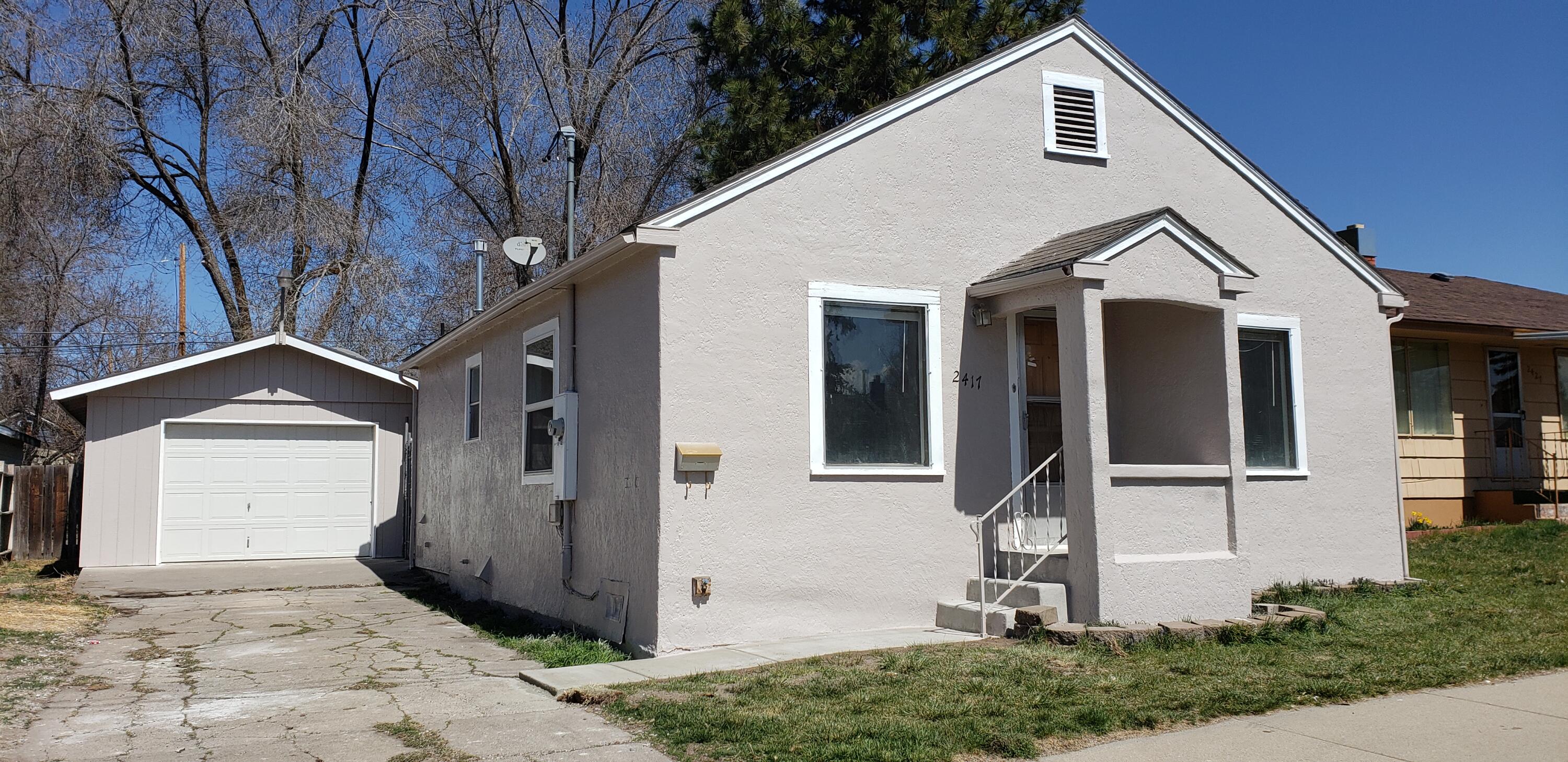 3 bedroom 2 full bath home in excellent condition. This home has almost all new interior and exterior paint. New laminate flooring.  Large master bedroom with garden bath. Spacious detached one car garage with concrete driveway. Alley access to back yard. Vinyl windows. Small corner of back lot has been partitioned off.  This is ready to move in.