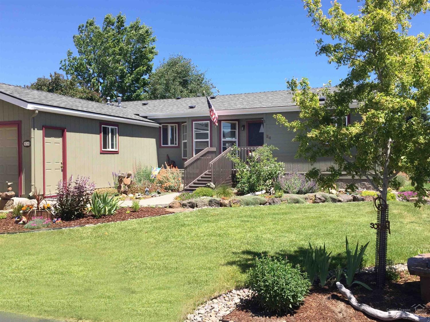 Beautiful 55+ Snowberry Village. Near medical community and lots of shopping. Walk to grocery store! Regular resident run clubhouse activities. Awesome & gorgeous, mostly low water-need landscaping. Sliding glass doors to a Large rear covered deck for your morning coffee and relaxation times. Large walk in closet.An old fashioned wood frame front screen door will take you back to simpler times growing up. Immaculate home with upgrades and updates (carpet, AC, toilets, screens, hot water heater, garage door, and paint.) Roof Replaced 4 years ago. Keep cozy on chilly days with the gas stove. All appliances remain. Space Rent includes all water, sewer, street snow removal, clubhouse and BBQ Pavilion.