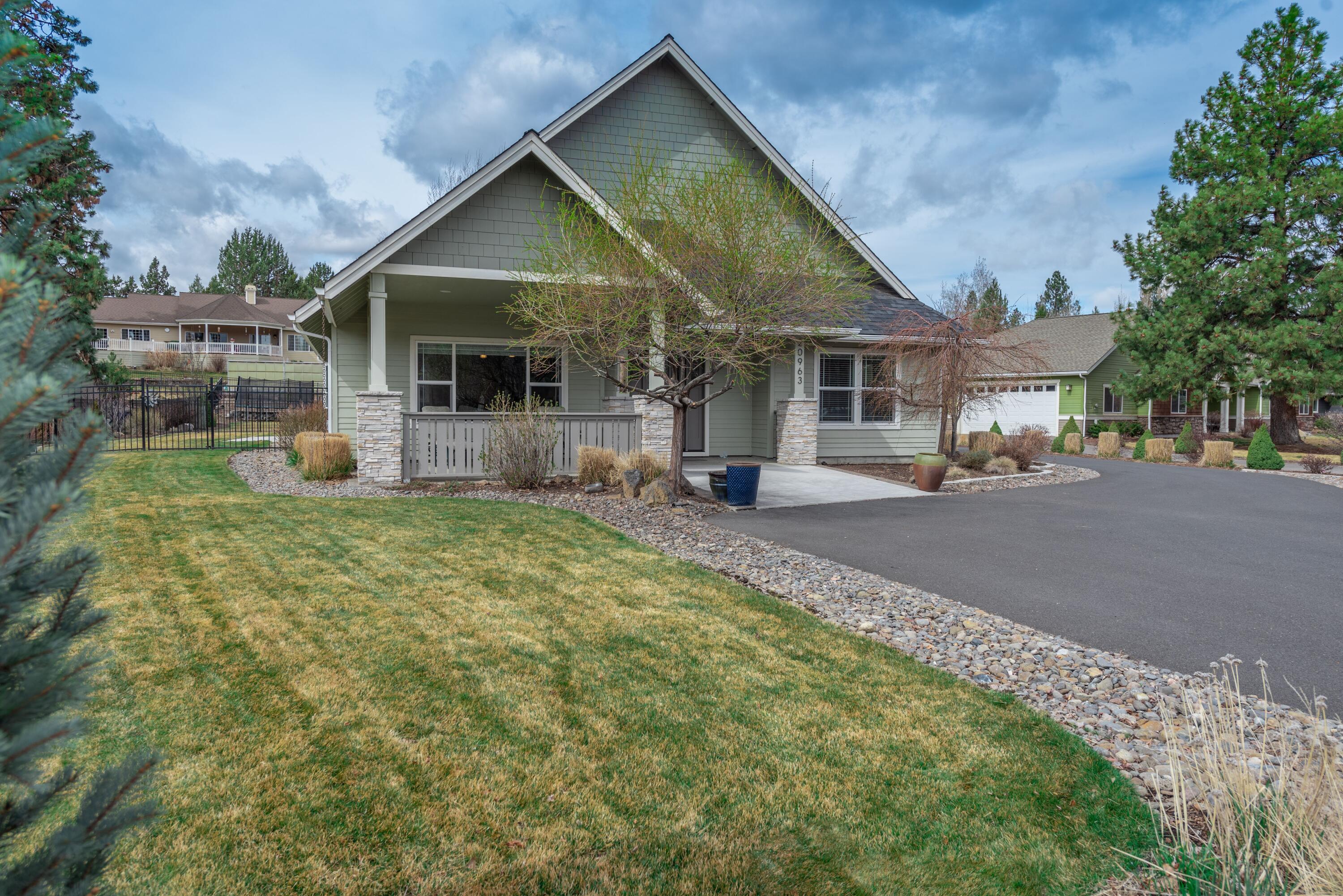 Hard to find newer home on a half acre lot in popular Orion Greens in SE Bend. The main house is all single level living with 3 bedrooms, 2.5 bathrooms. The gourmet kitchen opens to a big, bright great room with vaulted ceilings. All that plus a built in desk area off the hallway and a huge mud room/laundry room. Above the garage is the bonus space that includes a separate bedroom/full bathroom and living space. Perfect for guests or older kids with room for both a TV area and a pool table or ping pong table. It could be separate living space and has an outside entrance. Lots of options for outdoor living in the beautifully landscaped, level yard, and it even comes with swing set and trampoline. The two car attached garage is extra deep. Come see it!