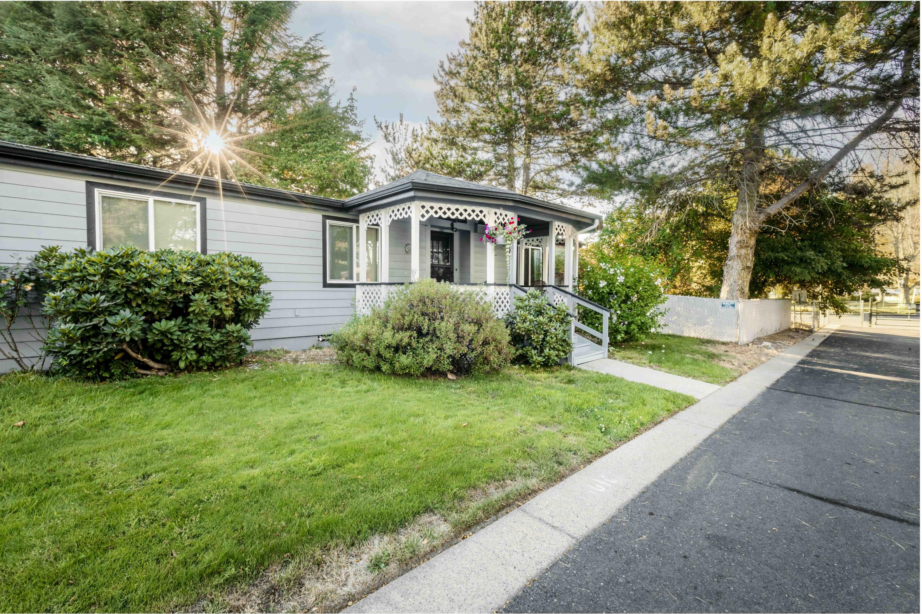 This beautifully maintained 3-bedroom, 2-bath home is located on OWNED PROPERTY in a 55+ community. NO monthly space rent/lease. The property features a new HVAC system, a new water heater, new vinyl windows (installed in 2022), and fresh exterior paint and a fenced yard for Fido. The attached garage provides a covered walkway to the back porch, which is also covered. 
Inside, you'll find a lovely open floor plan, complete with a built-in dry bar in the dining area that leads into a spacious kitchen. The roomy primary suite features a walk-in closet, while the primary bathroom offers both a soaking tub and a separate shower, making it a perfect retreat for relaxation. Low HOA pays water and sewer.
 Don't miss your chance to own this wonderful home!