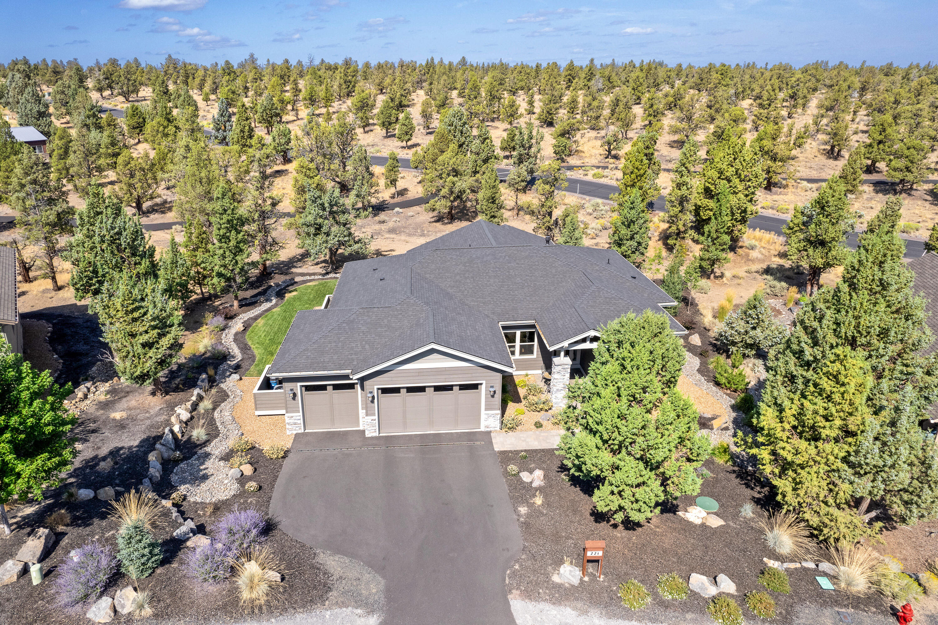 Motivated sellers bring all offers! 
This beautifully built Sage home has unobstructed views of the high desert terrain and offers a private and tranquil setting. Only two years old, the home features engineered hardwood floors, custom hickory cabinetry, main room surround sound speakers in ceiling, granite/quartz counter tops, gas fireplace, Kitchen Aid stainless appliances, stand alone soaking tub with shiplap accent walls, large tile shower, covered patio with powered sunshade, formal dining room, breakfast nook, power shades throughout the home with blackout shades in bedrooms, EV car plug, and a den/bonus room. Home still under builder two year systems warranty and ten year structural warranty. This warm and welcoming home should not be missed! Eagle Crest Resort features 5 outdoor pools, 3 sports centers, basketball courts, tennis and pickle ball courts, splash pool, 17 miles of trails, three 18 hole golf courses, restaurant/bar & cafe.