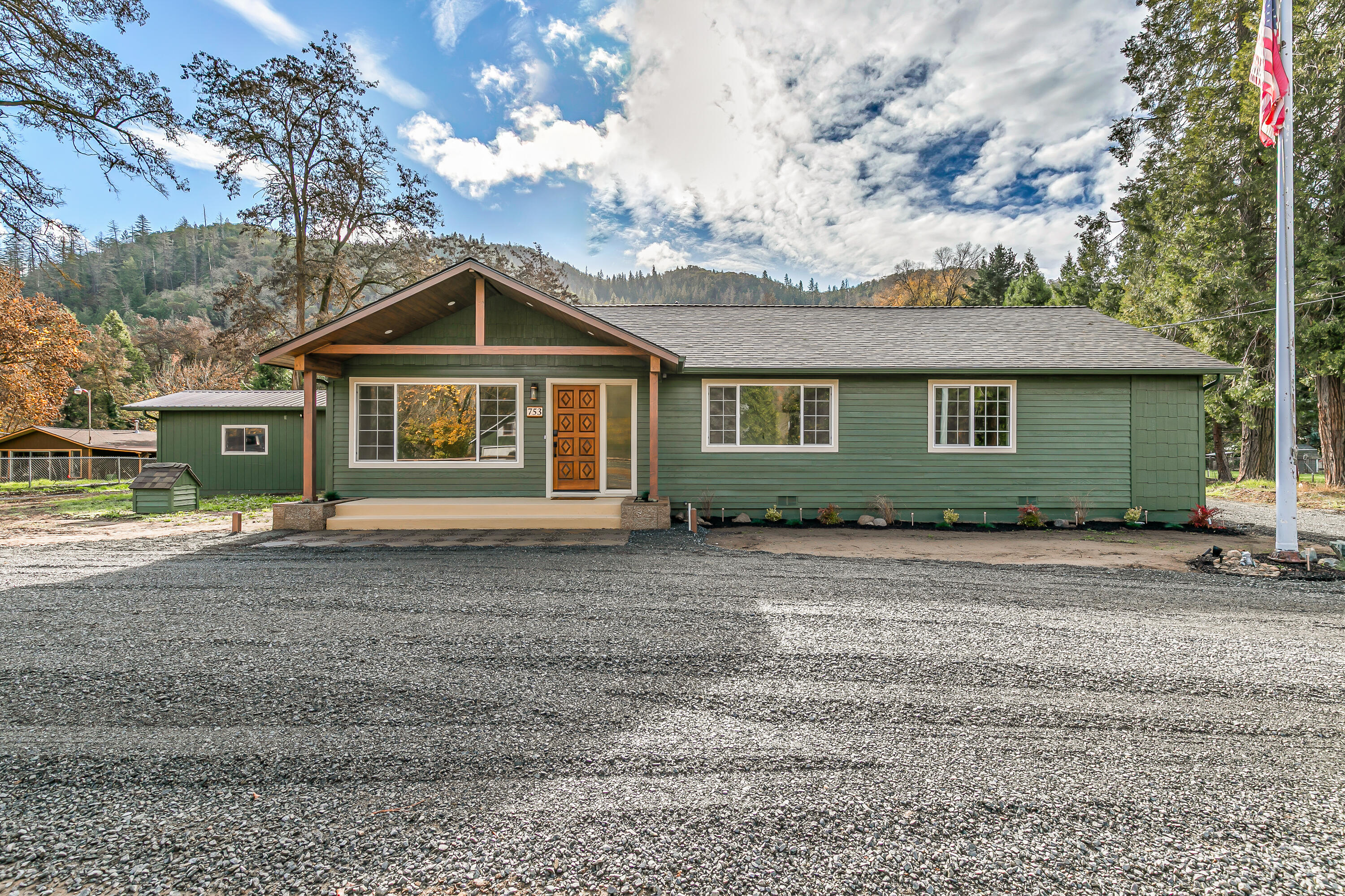 A total of 1,661 sq ft including a 185 sq ft bonus shop space!
This beautifully remodeled 3-bedroom, 2-bathroom home sits on 1.04 peaceful acres directly across the street from the scenic Rogue River in Gold Hill. Originally built in 1945 and thoughtfully updated, the home offers 1,476 sq ft of warm, inviting living space with the potential to easily create a 4th bedroom. Surrounded by mature trees and mountain views, it provides both privacy and a true Pacific Northwest atmosphere.

The property includes a detached garage, pump house, and a versatile shop perfect for hobbies, projects, or additional storage.

Note: The home itself is 1,476 sq ft, plus an additional 185 sq ft from the detached shop, bringing the total usable space to 1,661 sq ft.