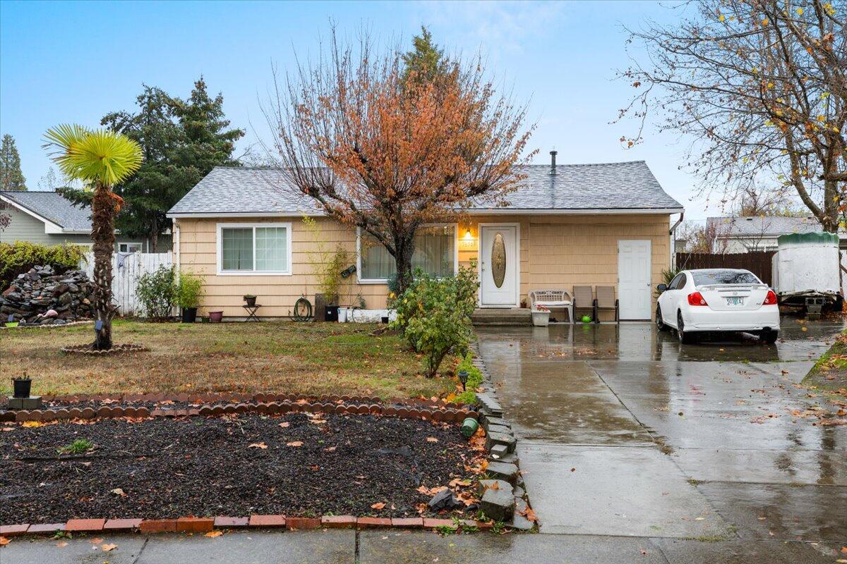 Welcome to this charming 2-bedroom, 1-bathroom home nestled on a spacious .21-acre lot! Per seller home is 1,065 sqft. Home is near Burns Park, Cascade community pool, Skate Park and near 2 elementary schools! Step inside to discover a cozy layout complemented by a versatile bonus room, ideal for a home office, playroom, or additional living space, currently being used as a bedroom. Outside, you'll find a fully fenced backyard, a large deck, a storage shed with plenty of fruit trees, a waterfall and plenty of space for gardening, entertaining, or simply unwinding. Park plenty of vehicles with an extended concrete driveway with enough space for an RV, toys, etc. Let's not forget the converted carport providing a fantastic enclosed storage area or workshop, to bring your projects to life. Schedule a showing today!