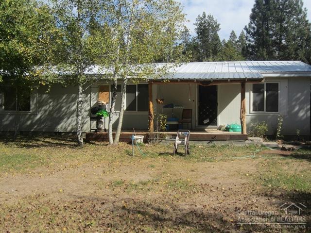 Close to town, BLM and the Deschutes River. Enjoy some of Central Oregon's best fishing, hunting & golfing-right in your back yard! This home has all new carpet/pad, laminate wood floors, intr paint. Plus a new metal snow roof on house & shop. Fenced, big circular drive. 30x34 shop w/concrete floor & upstrs loft would make a great office. Enclosed sunroom adds sq.footage. Horse property, RV dump, insulated well pump. Mature aspens. Perfect retreat for full time or vacation.
