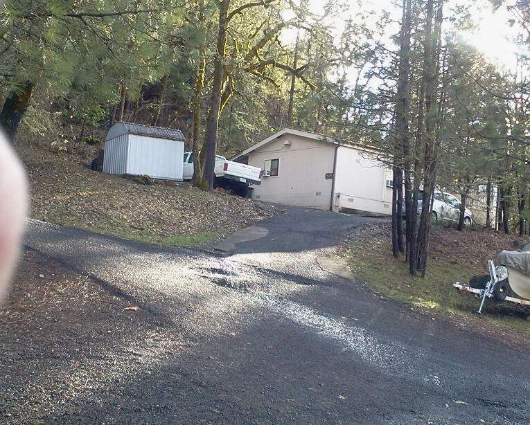 This 1985 Manufacture has an open floor plan with many windows around the living room & dining area bringing in lots of light. Situated on .50 acre hillside & is on the South side of the bridge in Shady Cove. Mature Oaks, views & close in proximity to the Rogue River